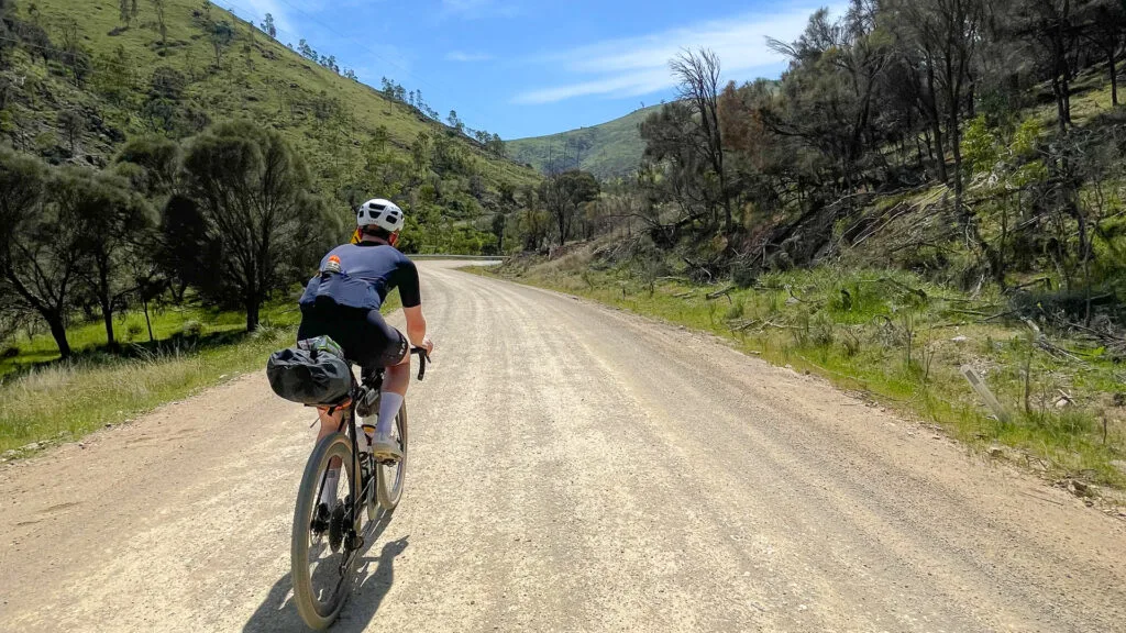 Cyclist climbing up into the Snowy Valleys