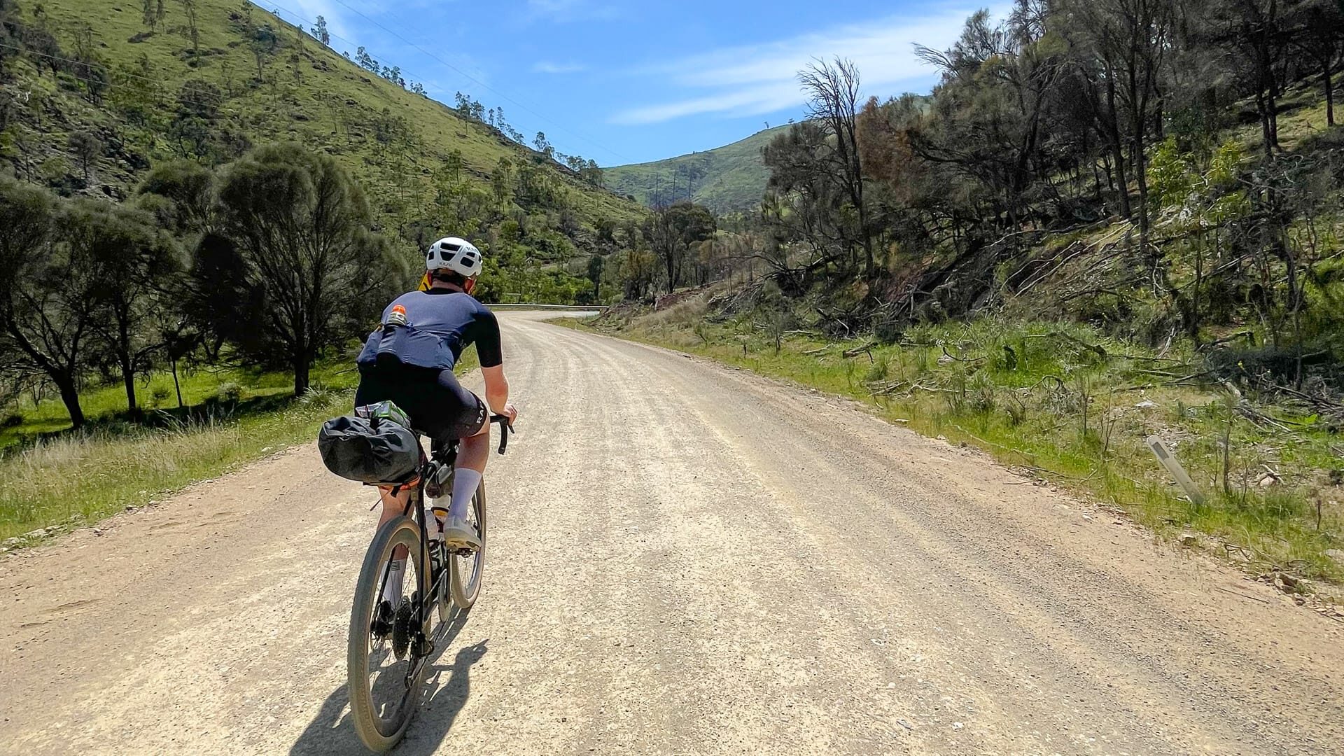 Cyclist climbing up into the Snowy Valleys