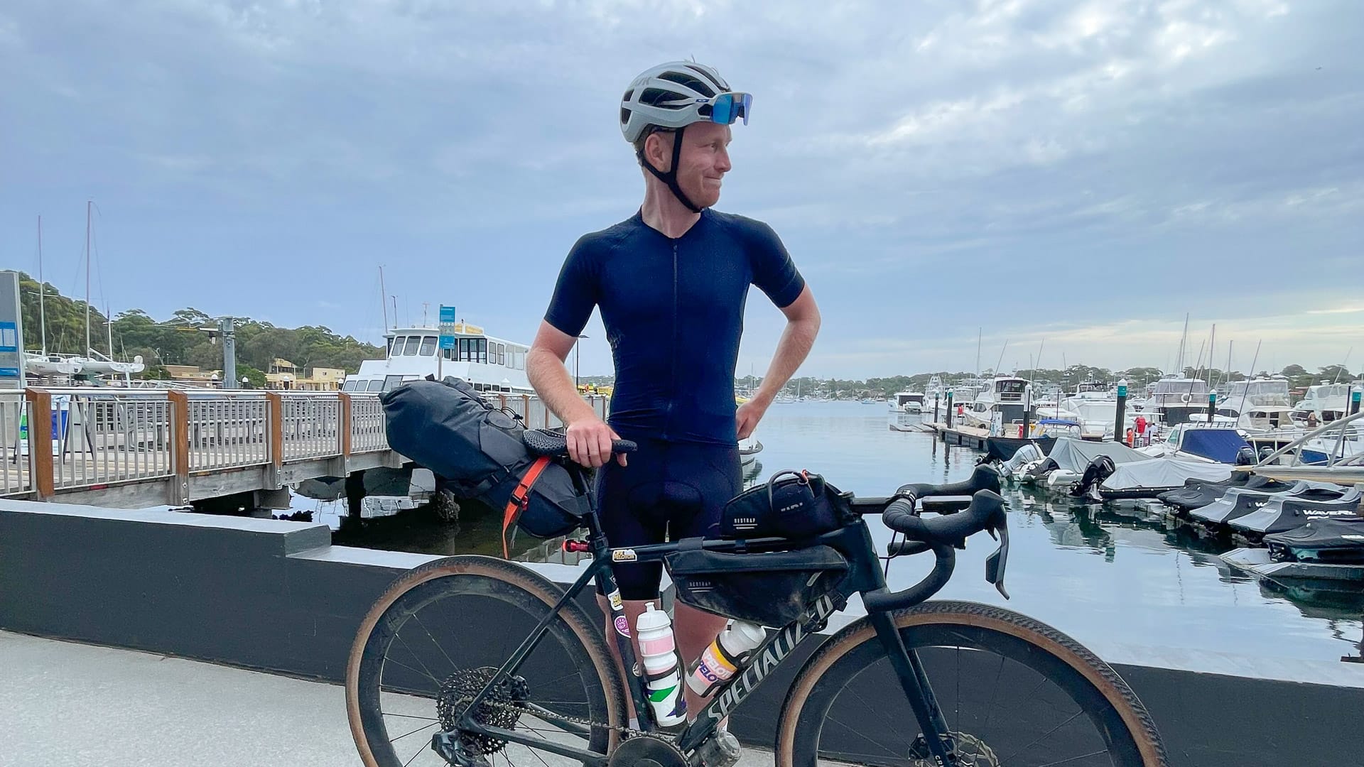Cyclist in front of ferries in Cronulla