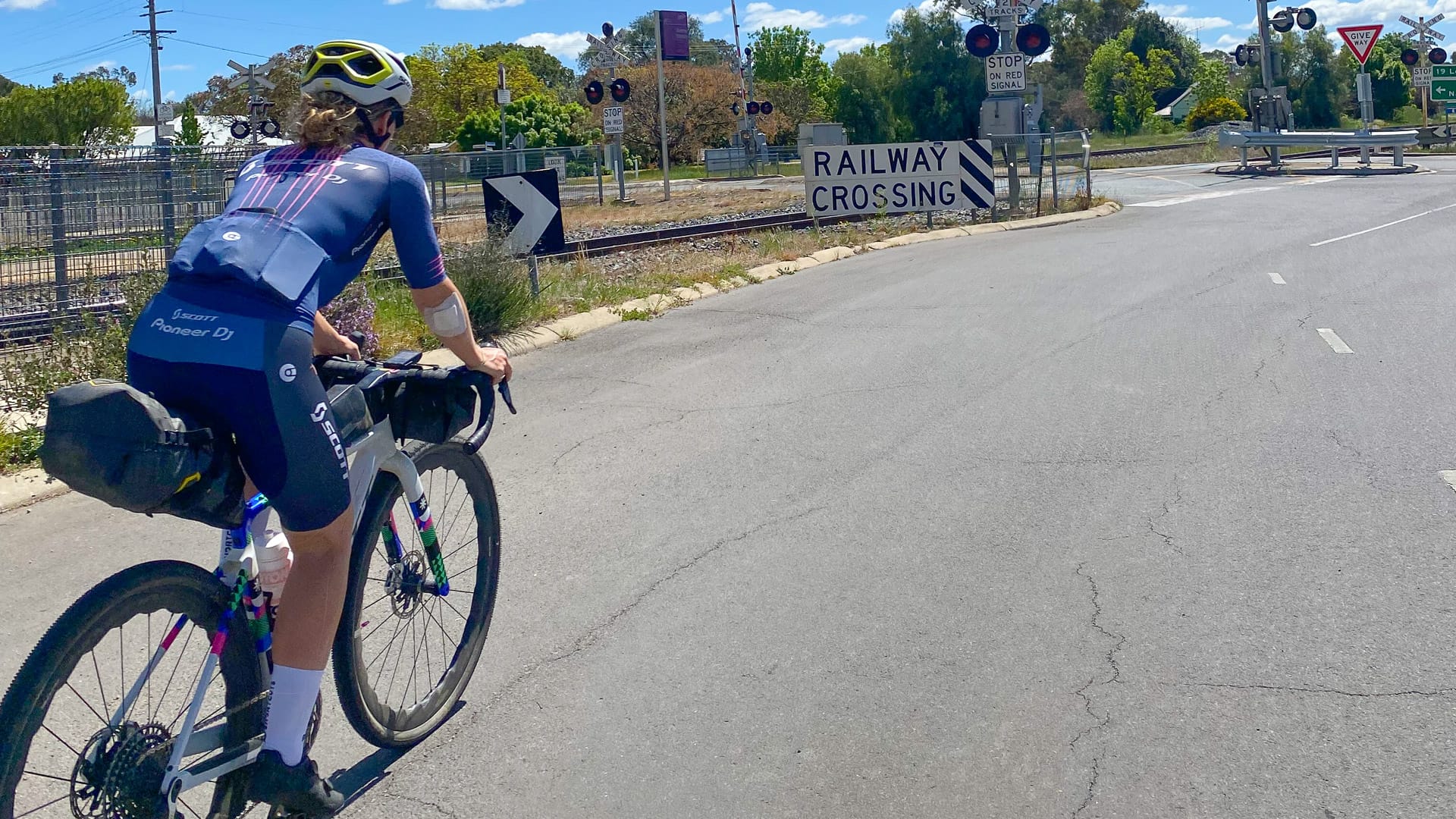 Cyclist leaving Avenel over the railway line
