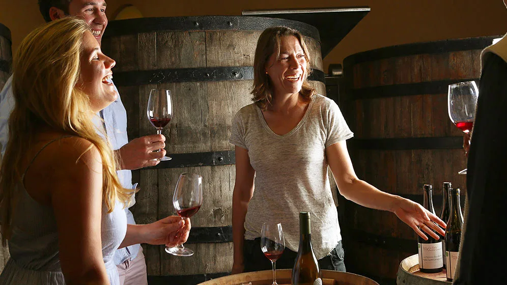 People enjoying a wine tasting in Beaune, Burgundy, France