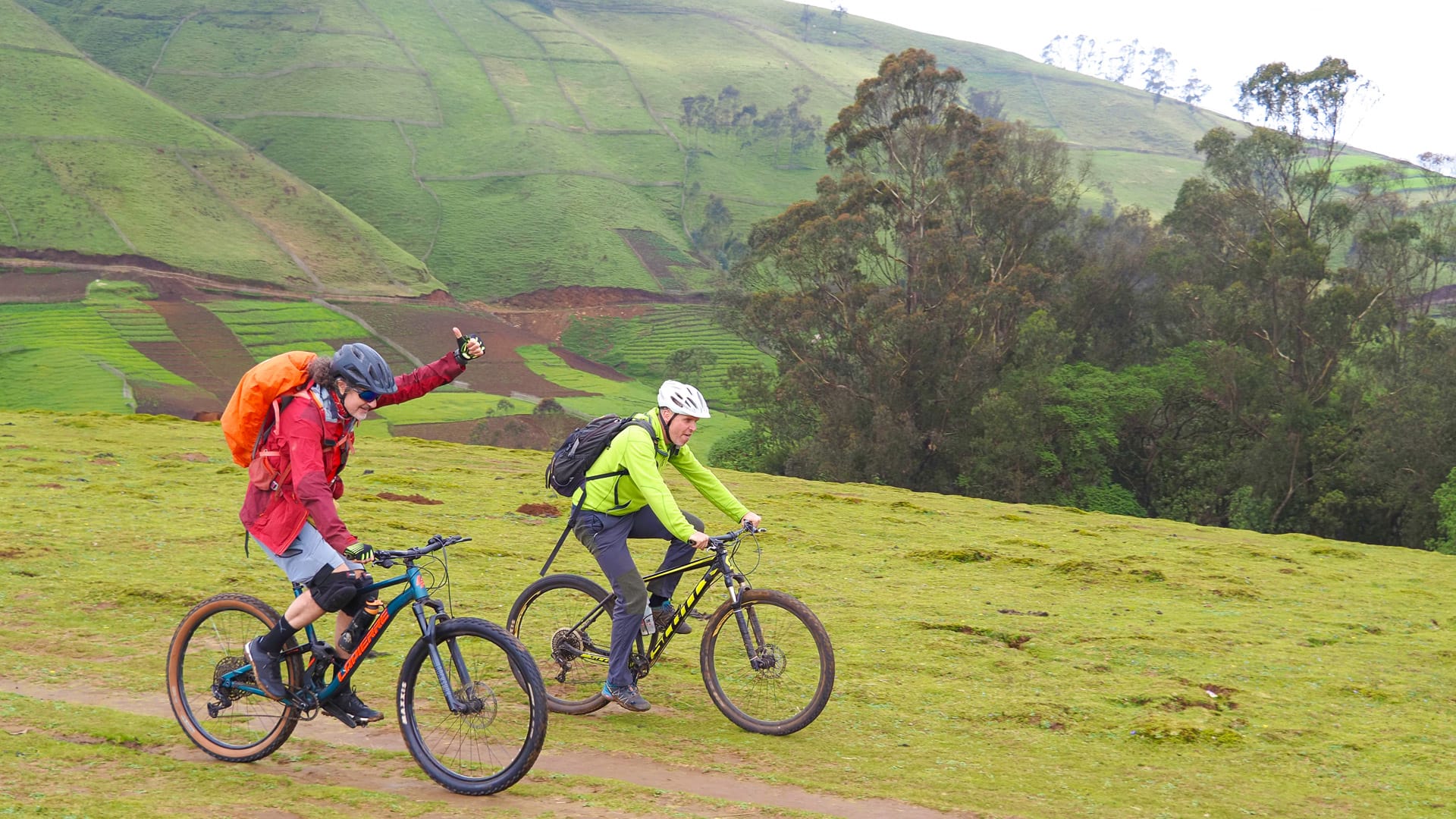 Two cyclists riding the Gamo Highlands