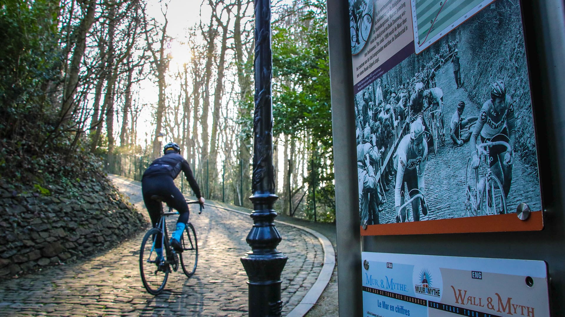 A cyclist rides bicycle through Climbing the hill come on bike tour in Belgium 