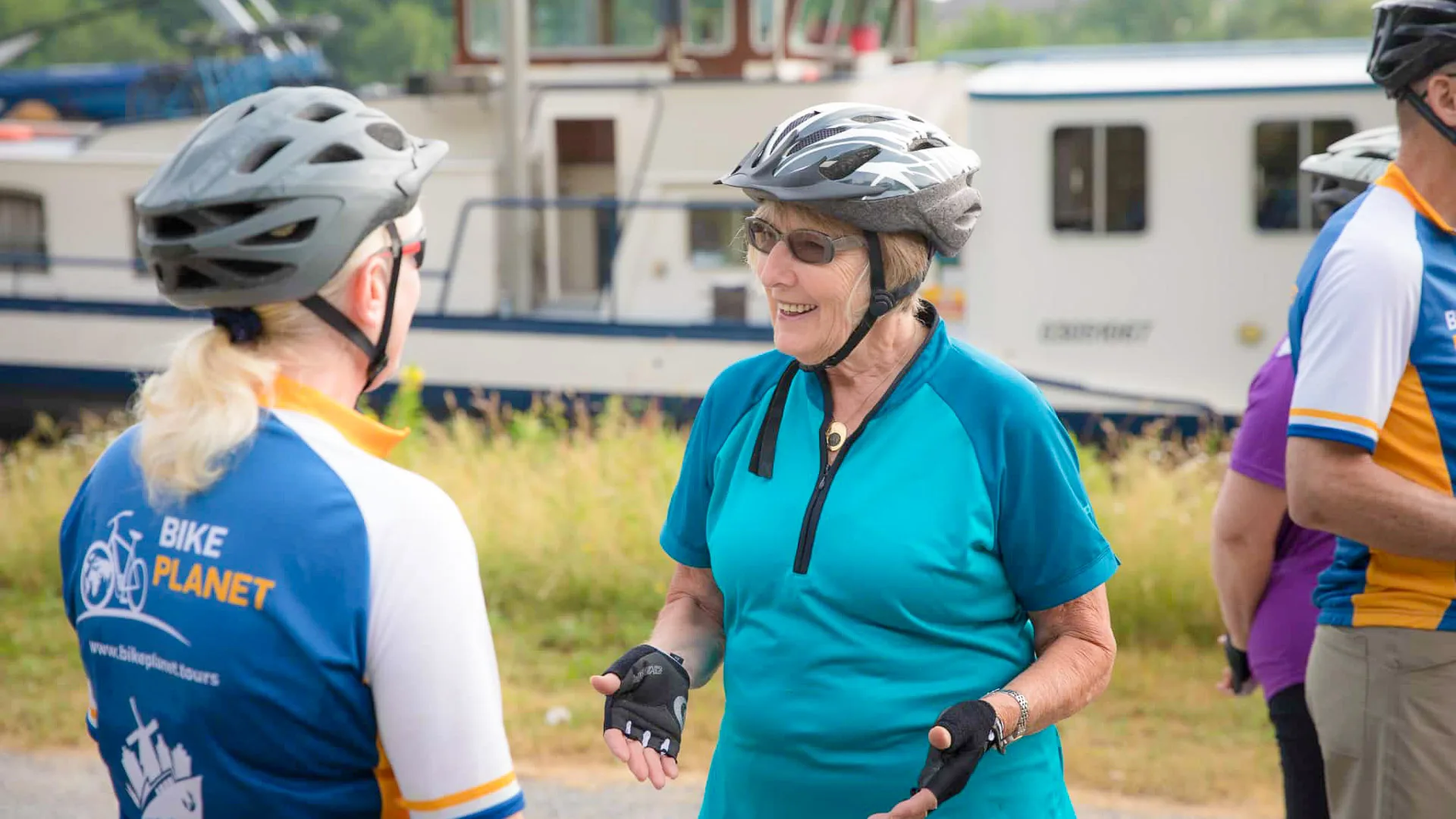 Senior cyclists interacting with each other during a BikePlanet Tour