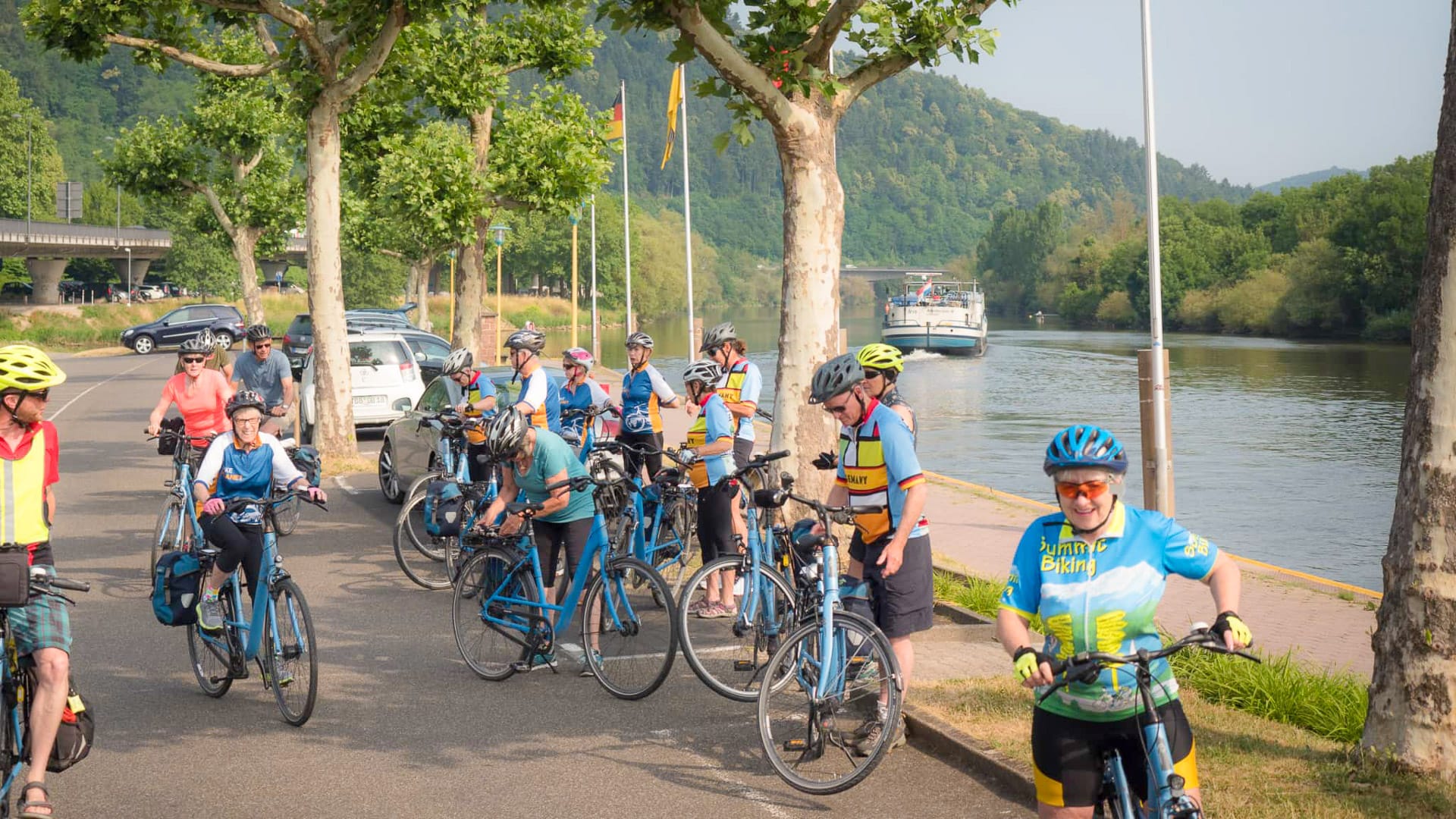 Cyclists gathering and preparing their bikes beside the Main River in Germany