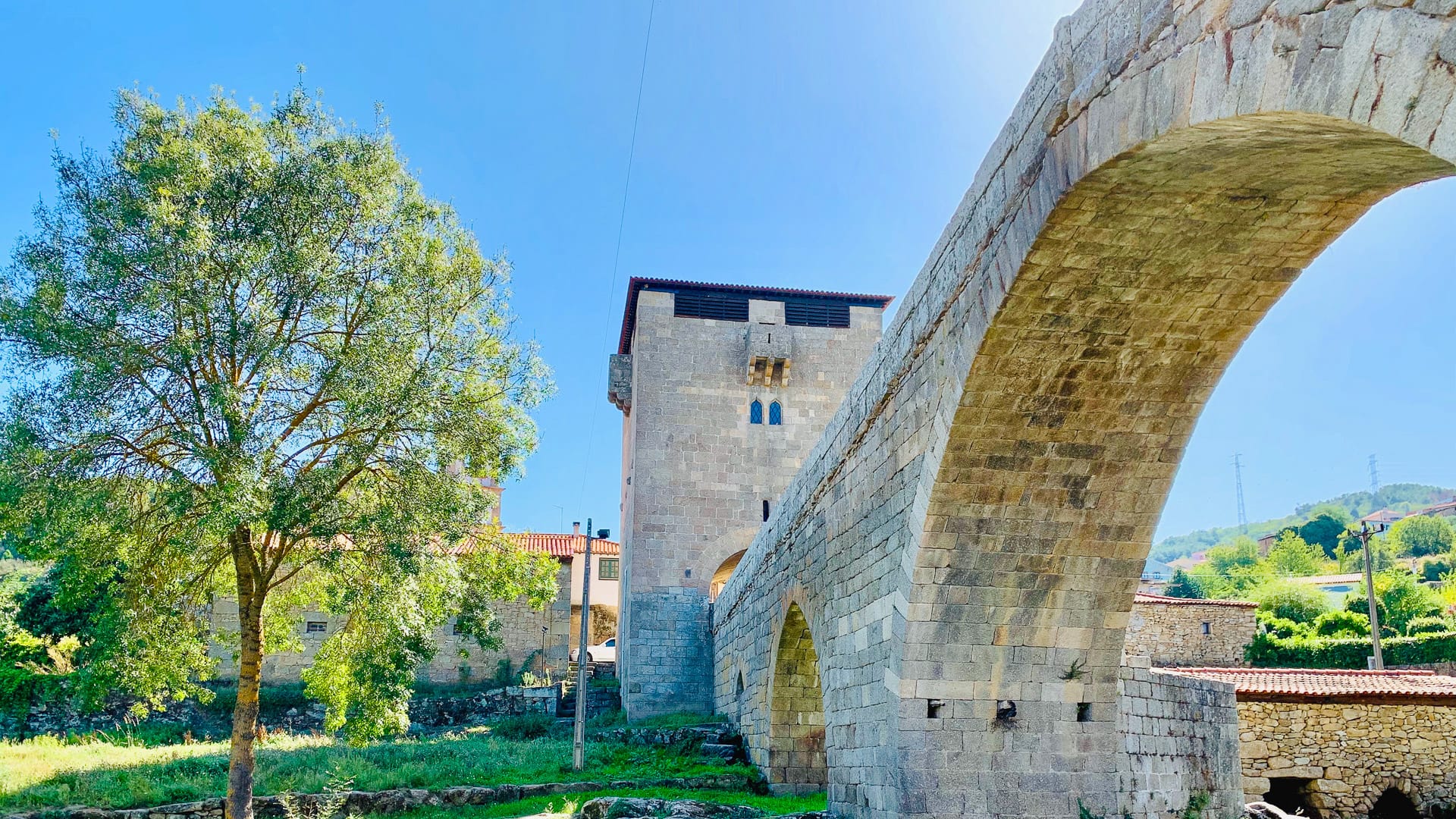 Historic stone bridge and tower in the Douro Valley, Portugal