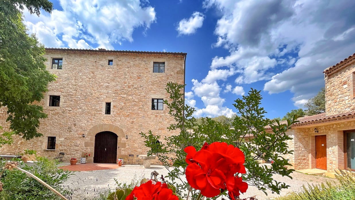 Exterior view of Hotel Mas Pelegri, a restored countryside cycling hotel in Girona, Spain