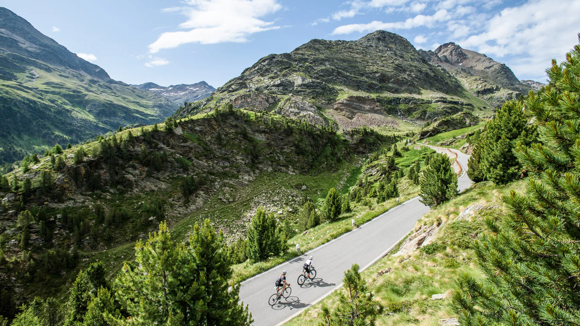 Cyclists tackling a mountain road in Italy on the Giants of the Giro bike tour with Saddle Skedaddle