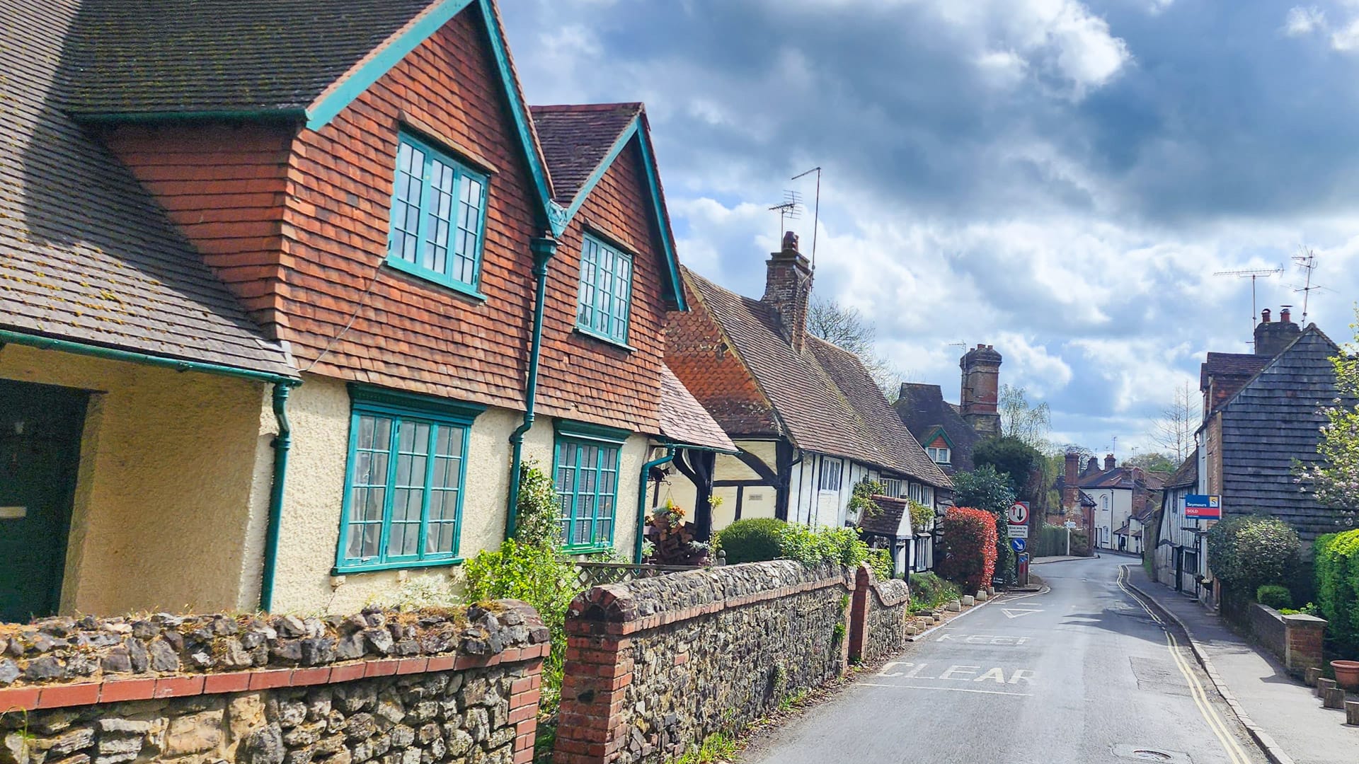 Classic English village scene with quiet street