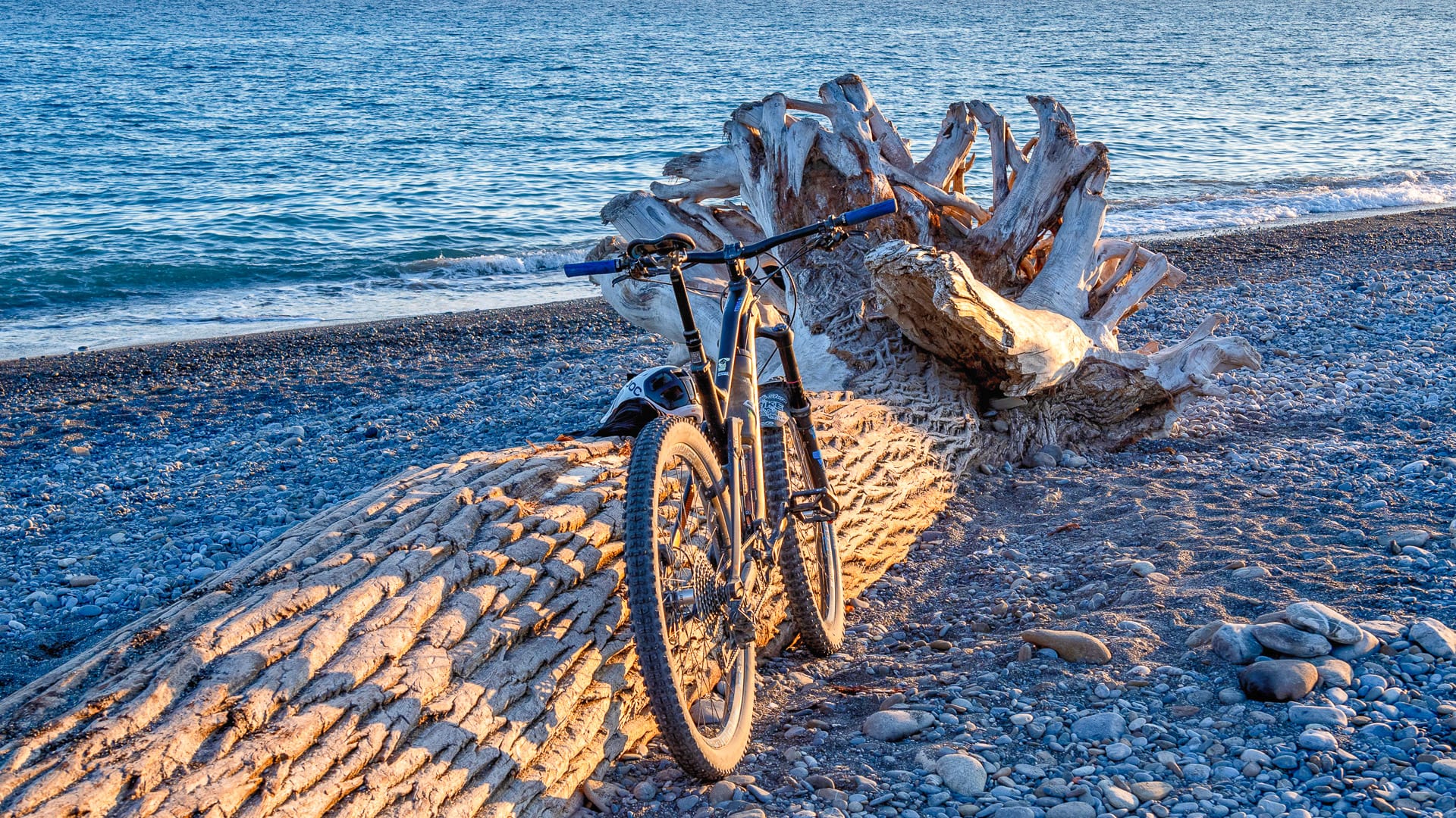 Bike parked on Ventimiglia beach on the Ligurian coast