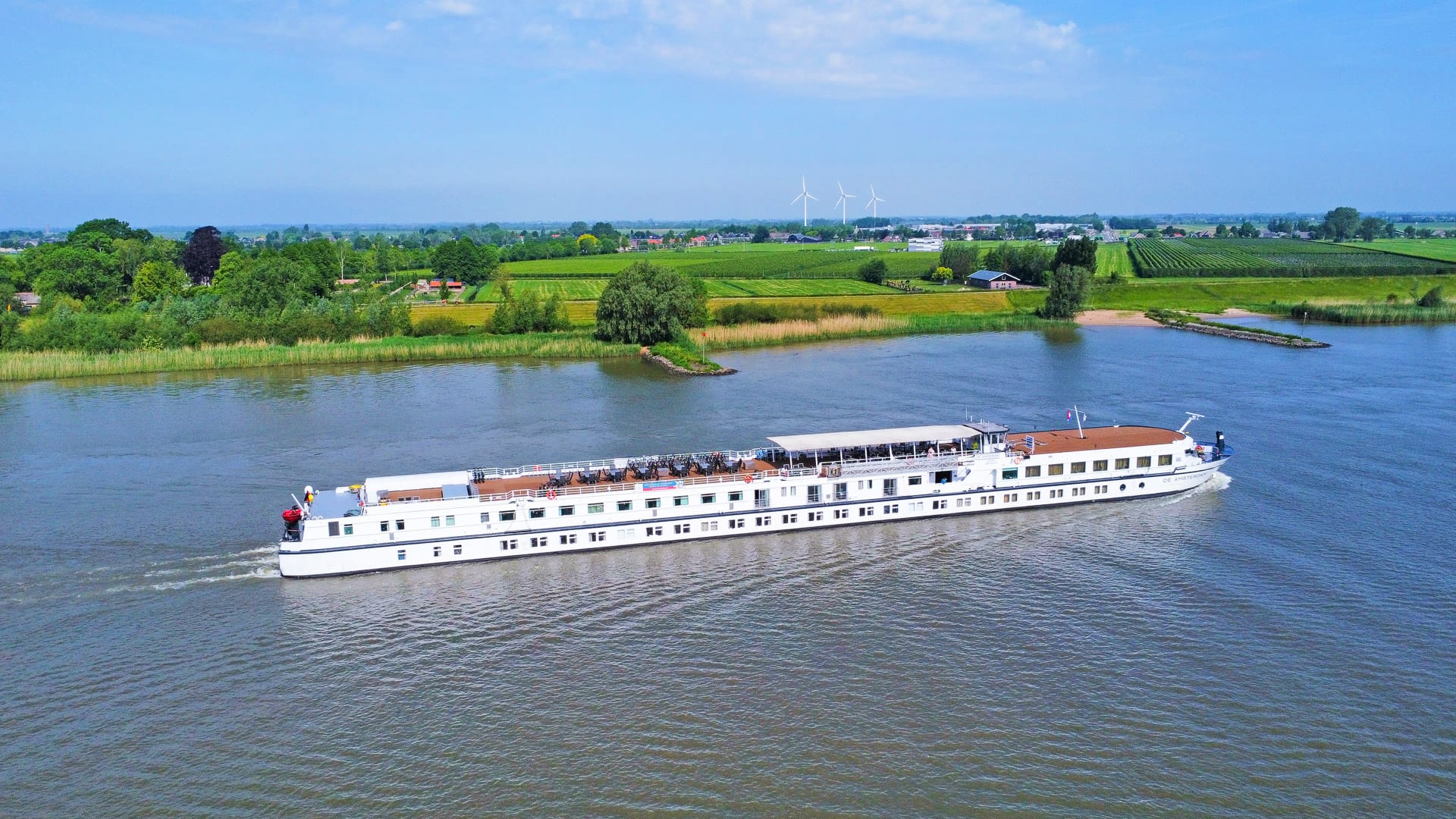 Boat sailing on the River Lek between Schoonhoven and Vianen in the Netherlands