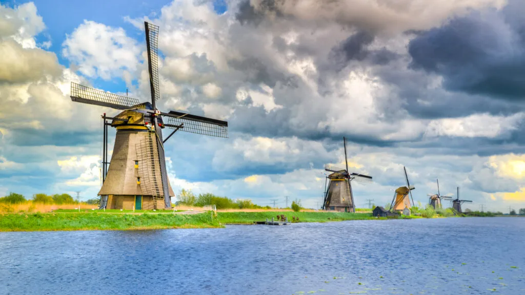 Windmills at Kinderdijk in the Netherlands with canals and traditional landscape