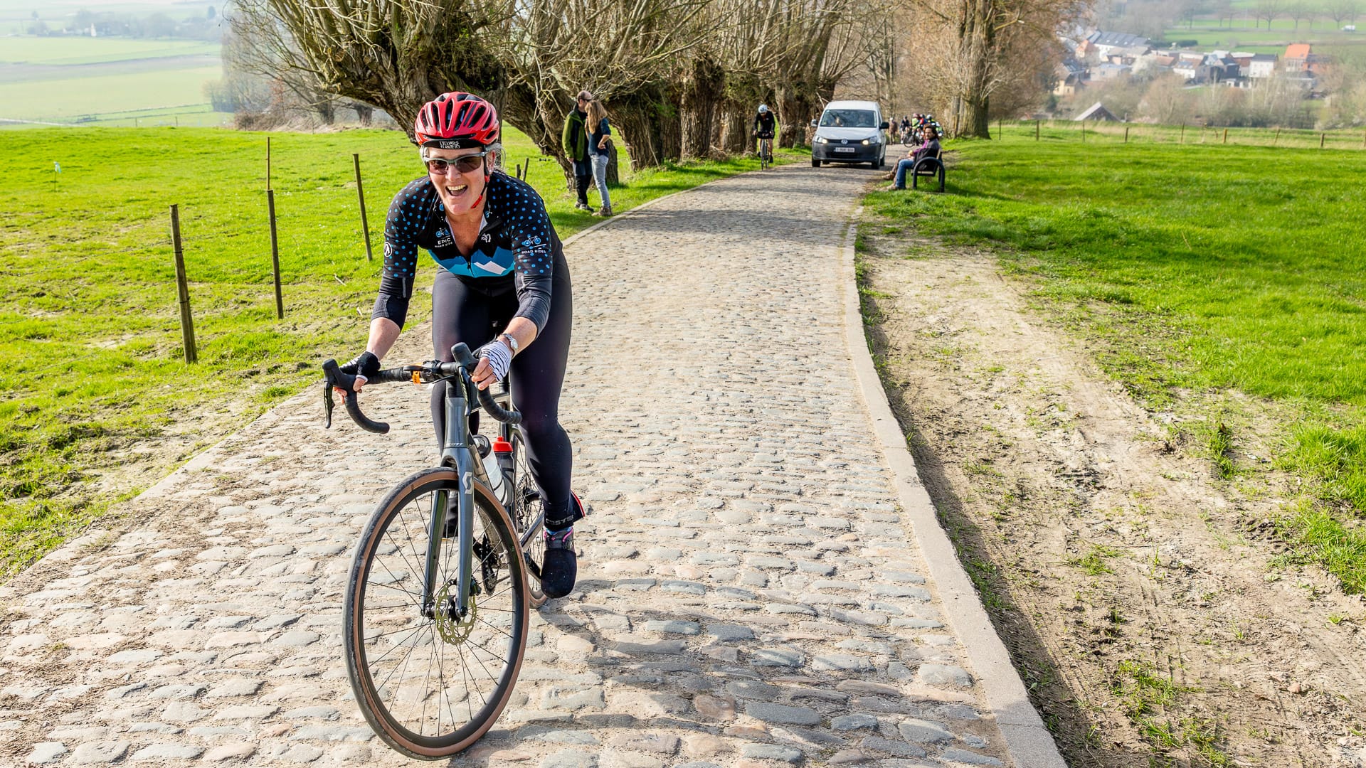 Woman cyclist riding the Bergs and Cobbles of Flanders