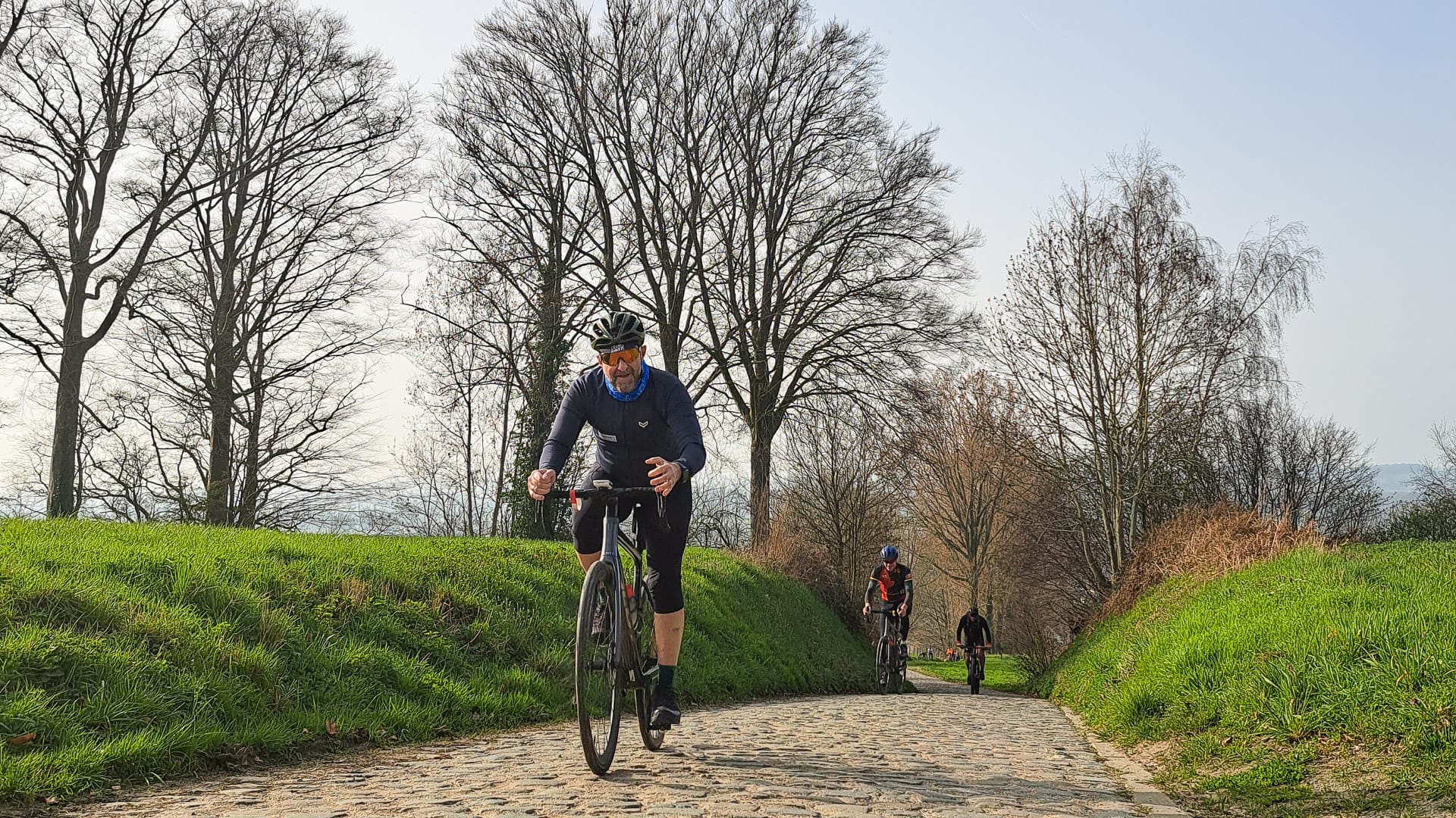 Cyclist reaching top of one of the famous Belgian Bergs
