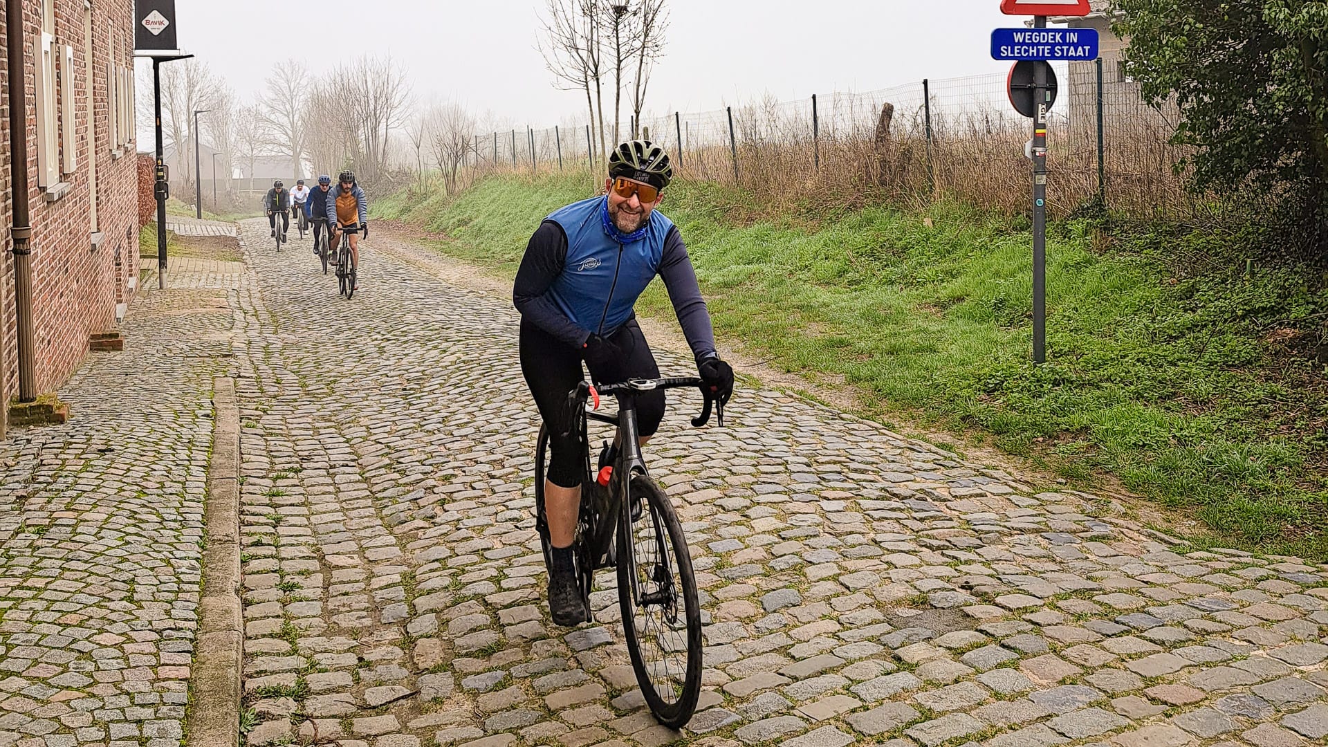 Cyclist enjoying the cobbled ride near Oudenaarde