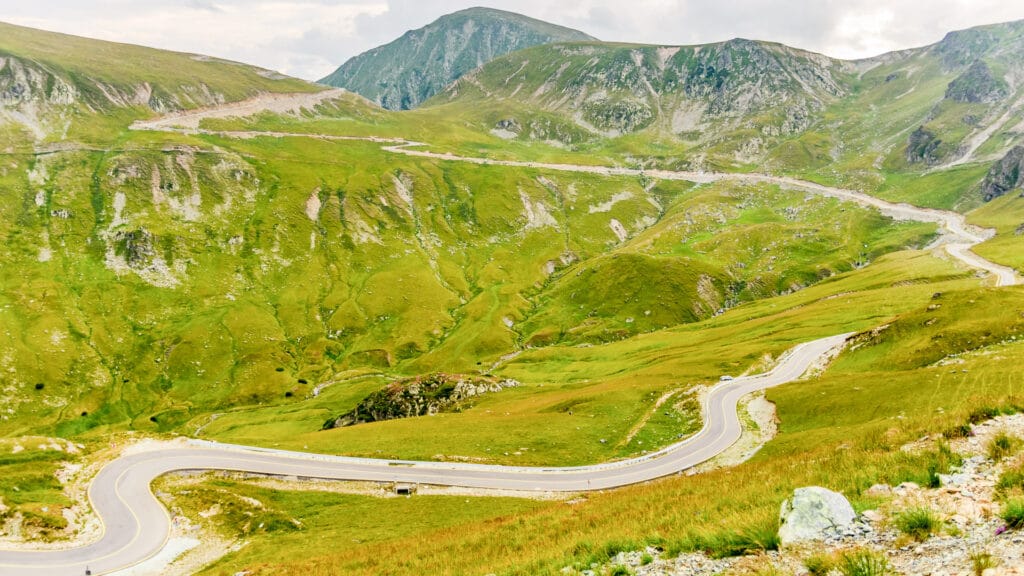 Switchback on way up Transalpina road Romania
