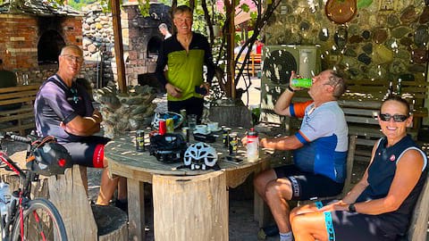 Cyclists enjoying a coffee stop north of Peshkopi in Albania 