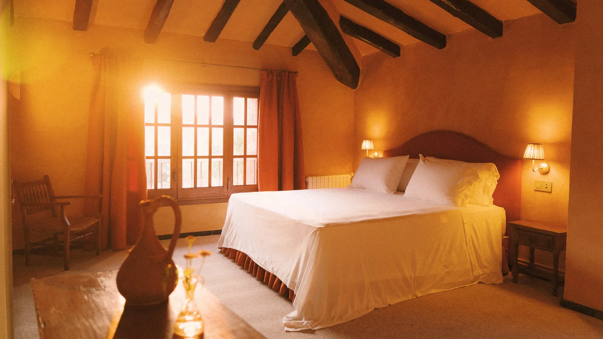 Guestroom featuring a queen-size bed and natural window light