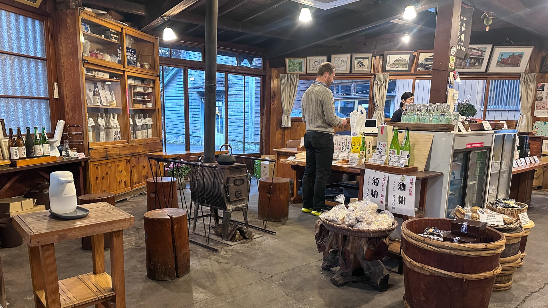 Interior of a sake brewery in Japan with barrels and production area