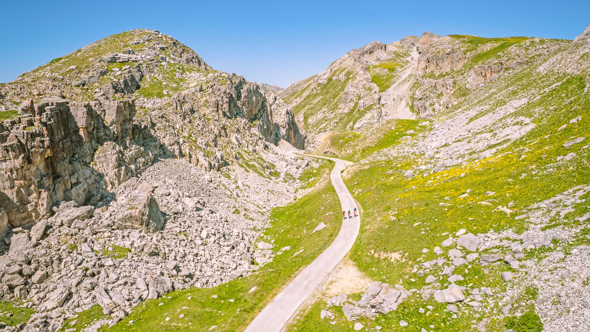 Cyclists climbing up to Fauniera Pass