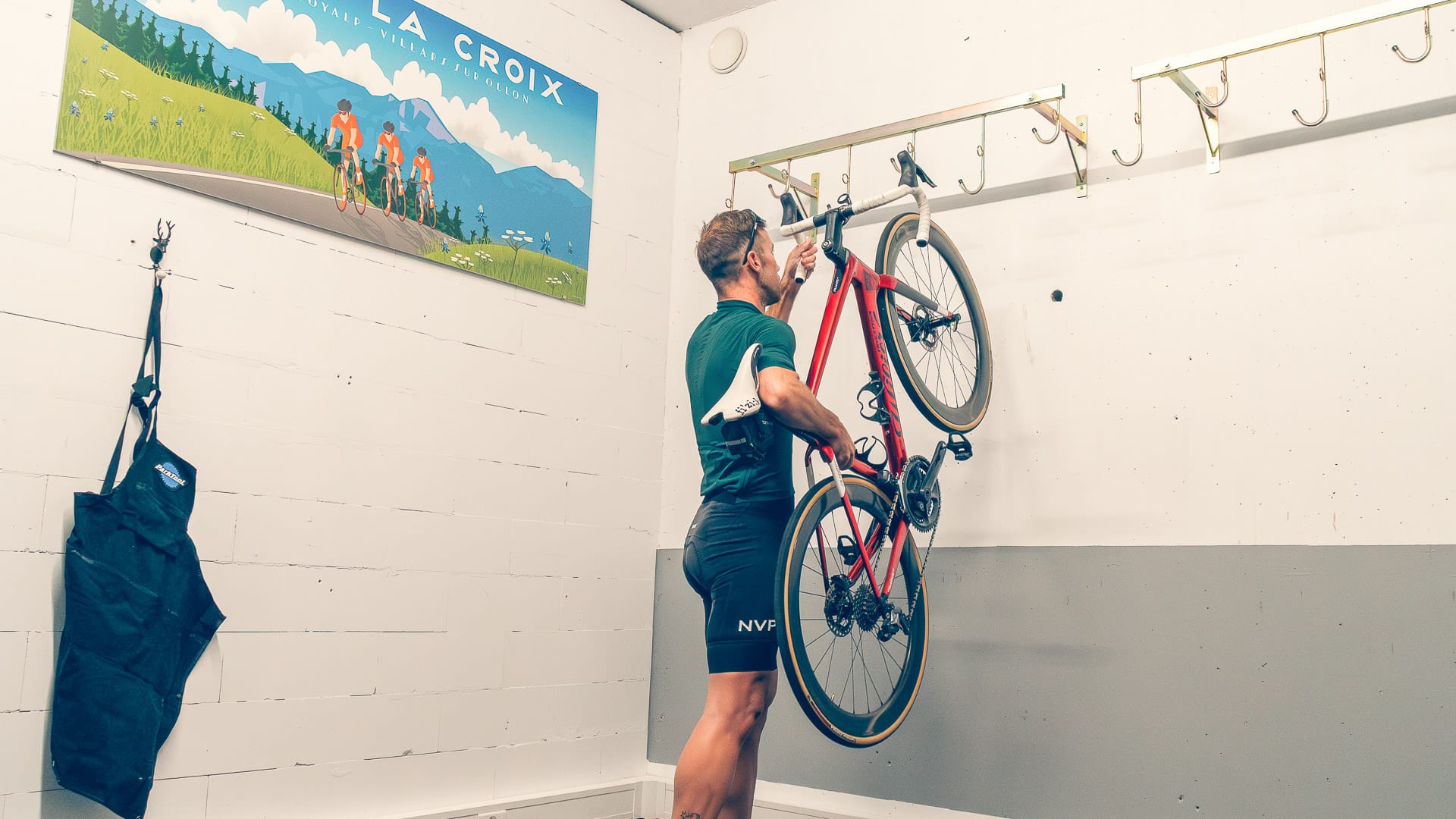 Secure bike storage room with wall-mounted racks at Chalet RoyAlp for cyclists exploring the Swiss Alps