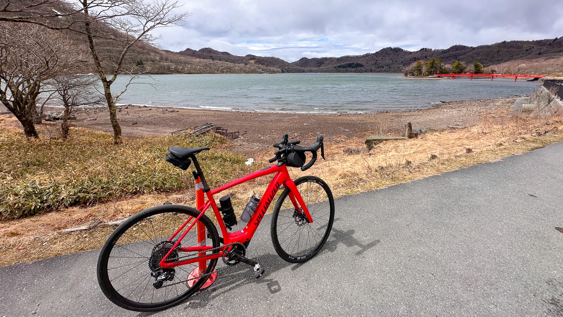 Bike parked by a lake near Mount Akagi in Japan on day six of the cycling tour
