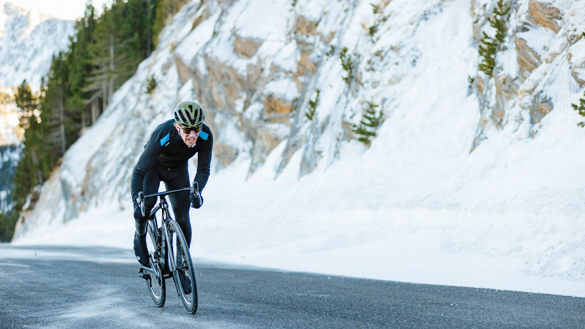 Snow-covered Alpine cycling route after an early snowfall