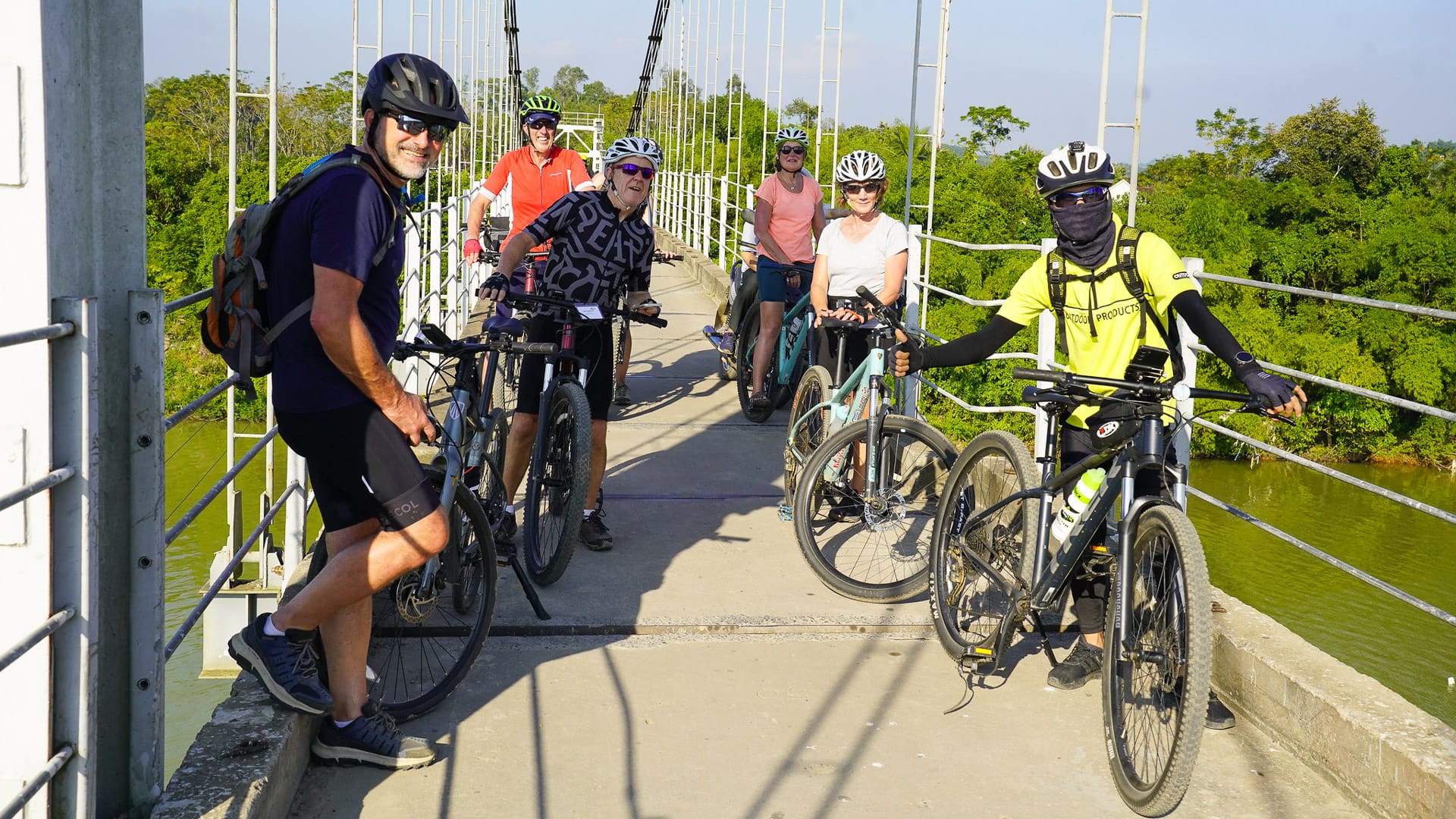 Smiling cyclists on a Northern Vietnam cycling tour