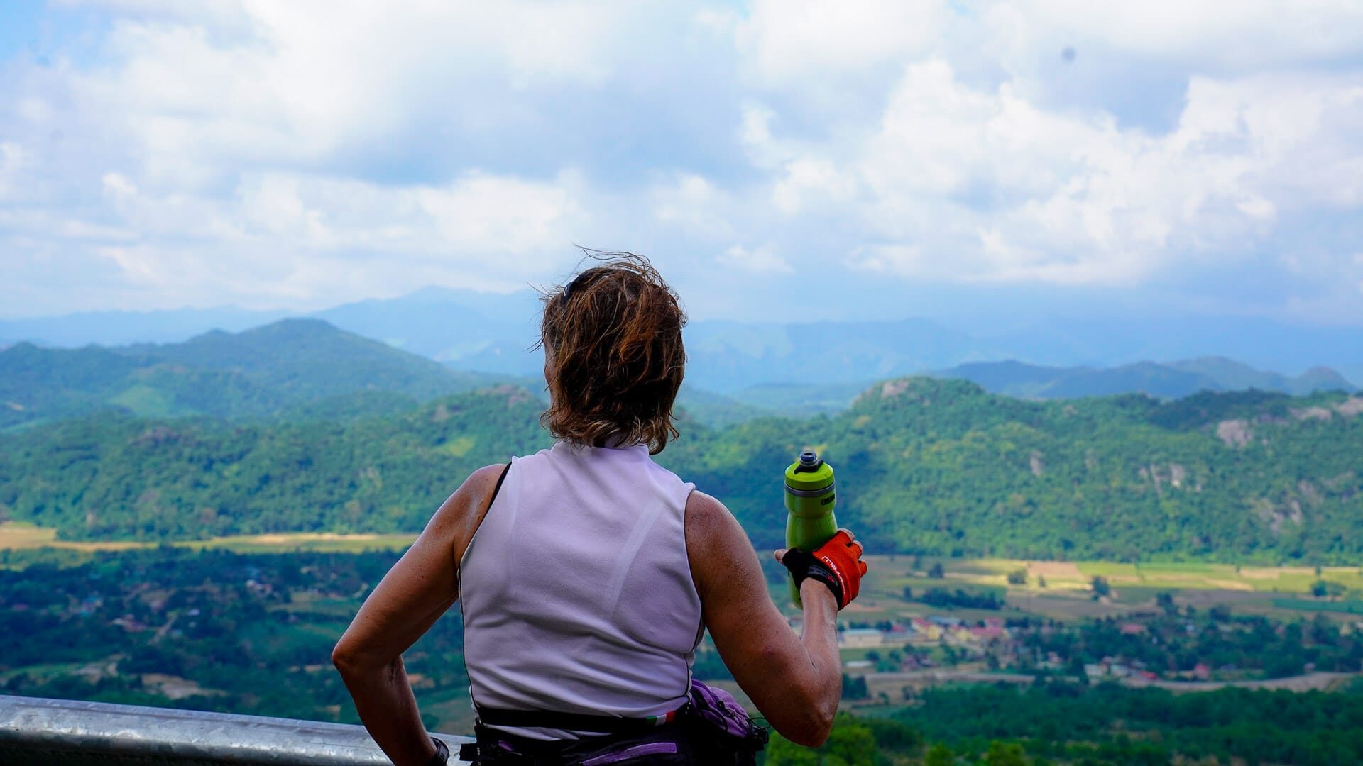 Cycling in northern Vietnam with wide landscape views over mountains and valleys