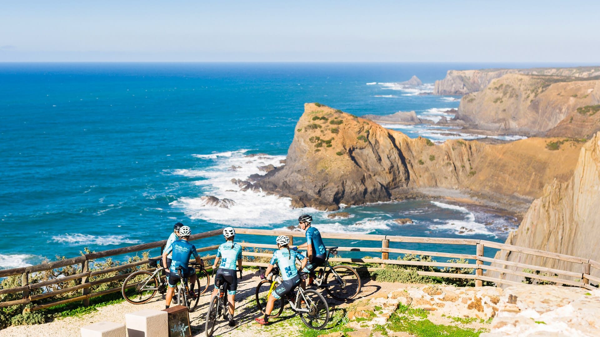 Cyclists looking out over the wild southwest Atlantic coast on the Costa Vicentina