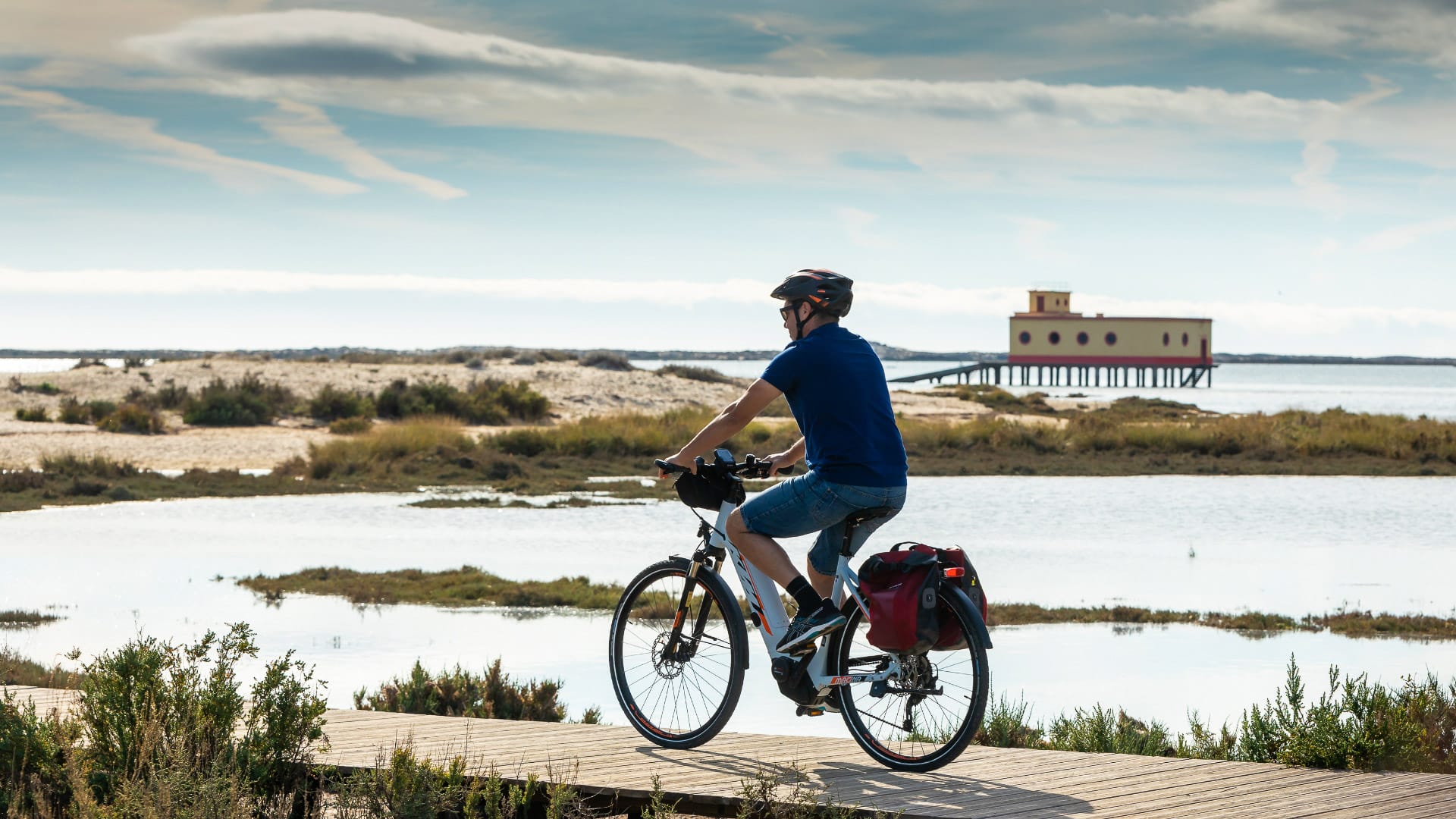 Cycling along Ria Formosa near Fuzeta on the EuroVelo 1 route