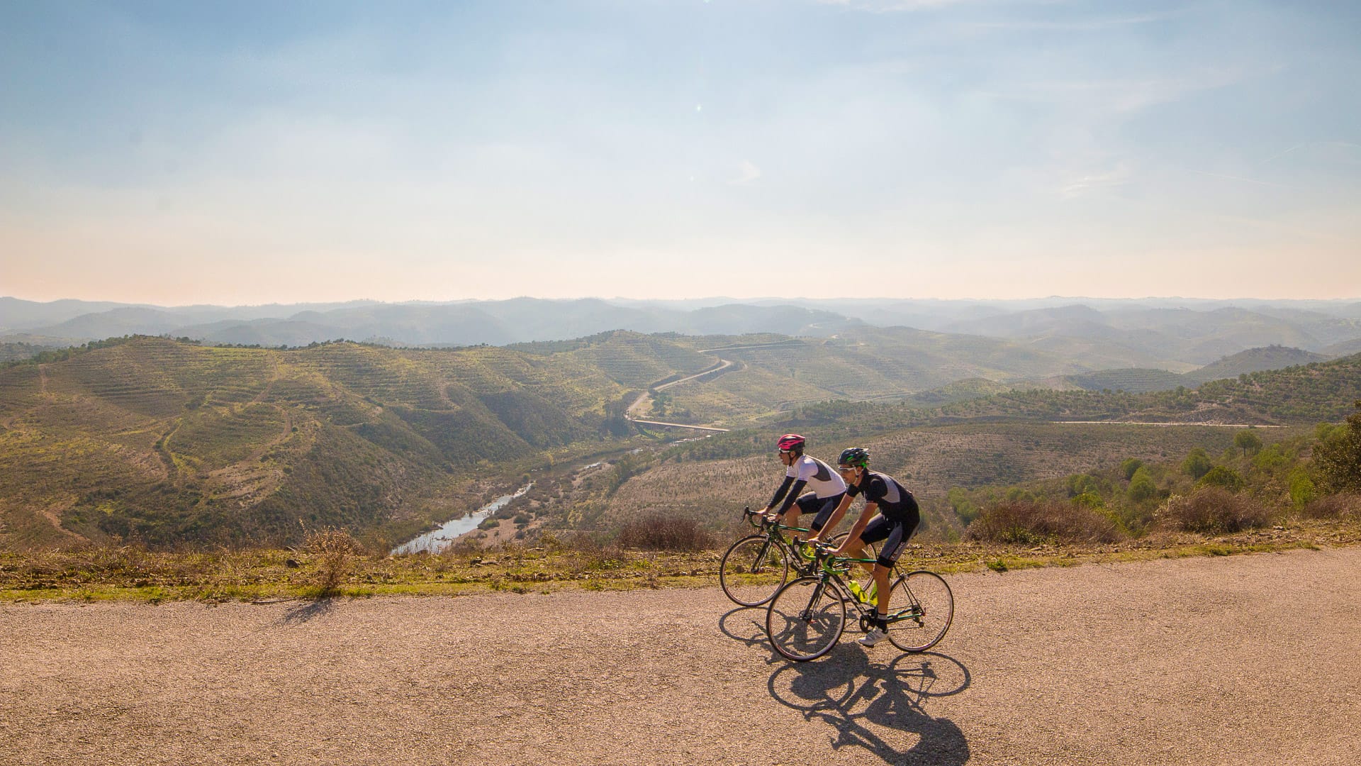Cyclist exploring car-free roads through the inland countryside of the Tavira hills