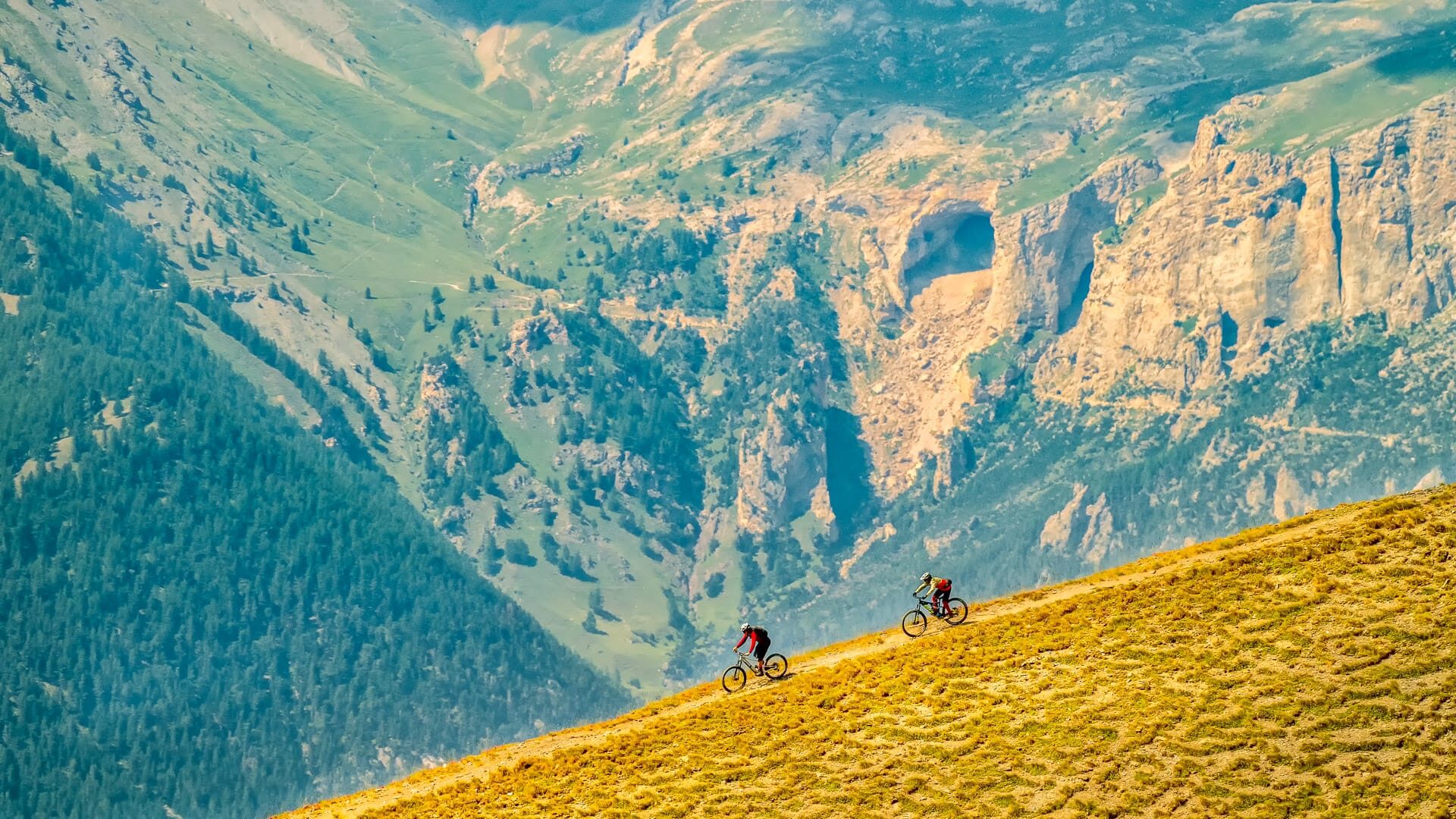 Cyclists climbing towards Sestriere in the Piemonte mountains