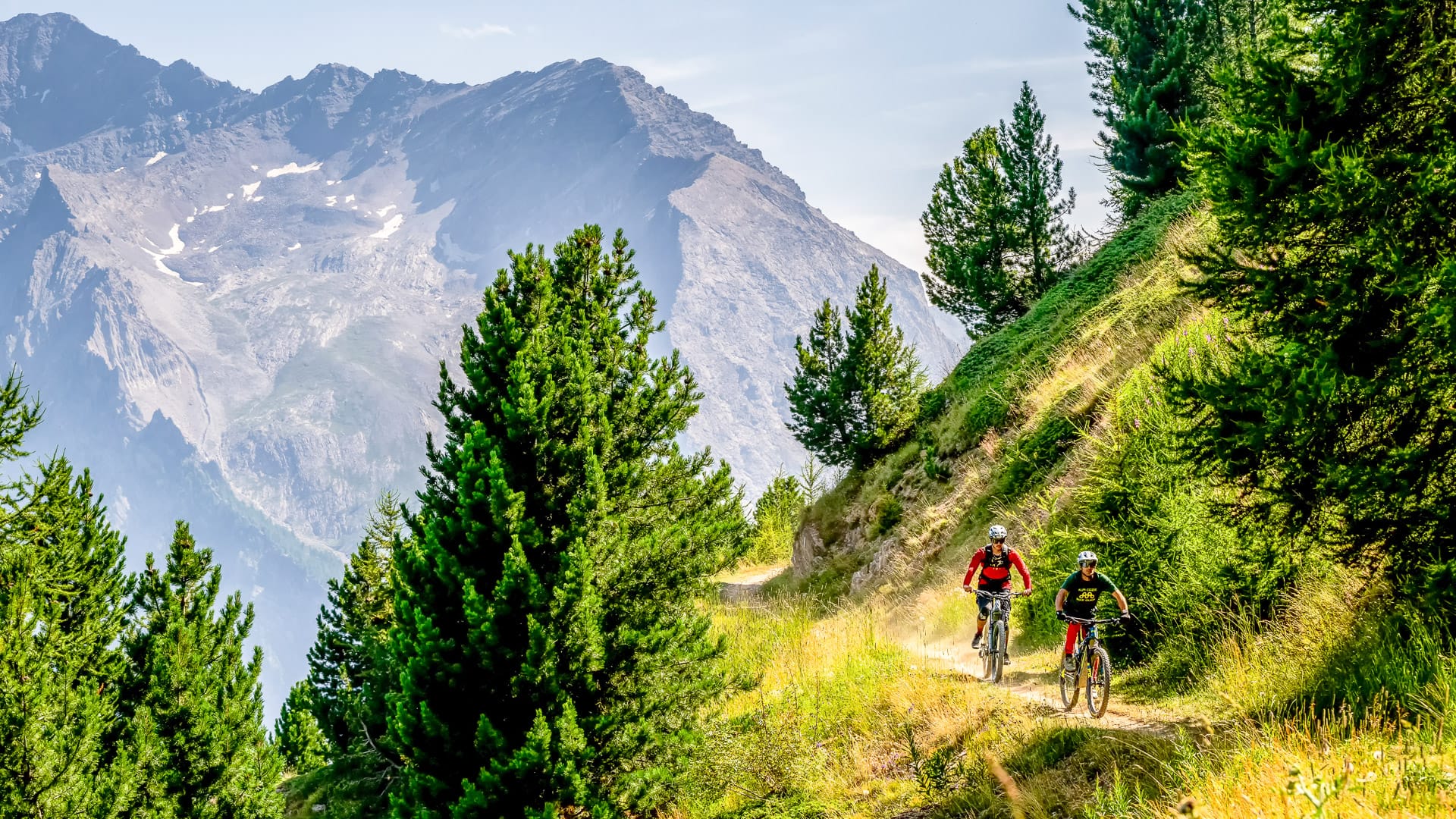 Cyclist riding through the mountain landscape around Sestriere, Piemonte
