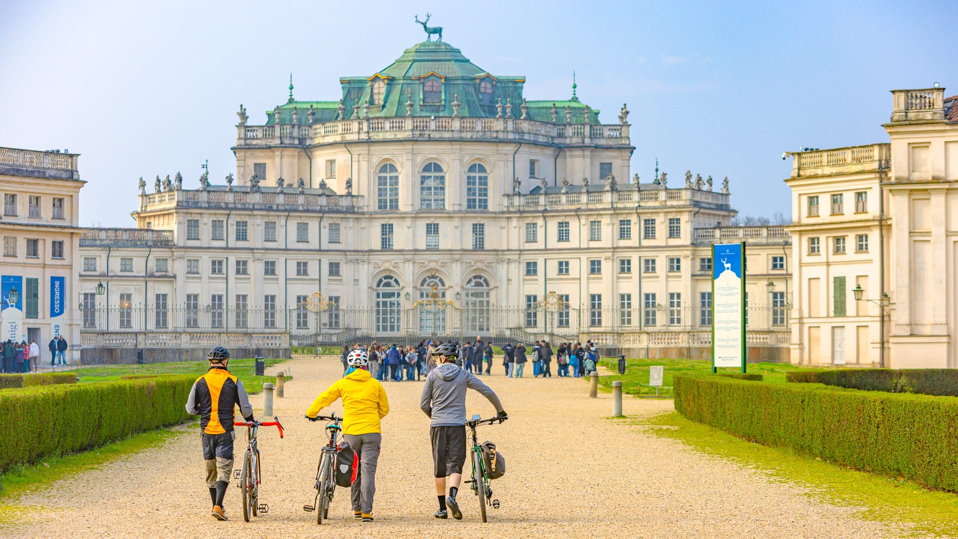 Cyclist admiring the historic Stupinigi palace architecture near Turin