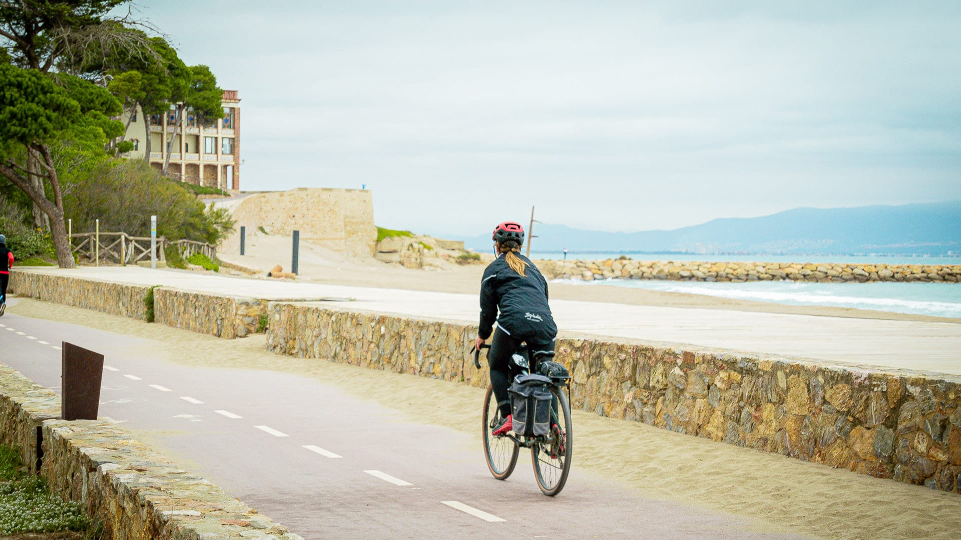 Cyclist following the Pirinexus route in Empúries, Girona