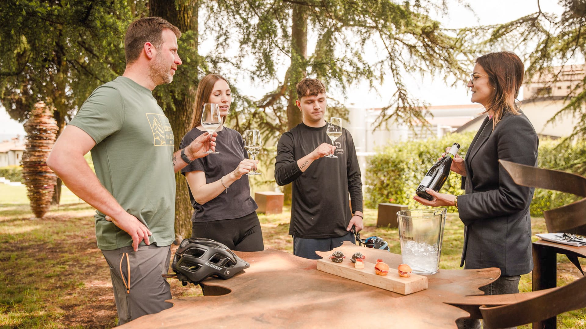 Guests toasting at Parco della Filandetta, the Bortolomiol family wine estate in Valdobbiadene, Italy