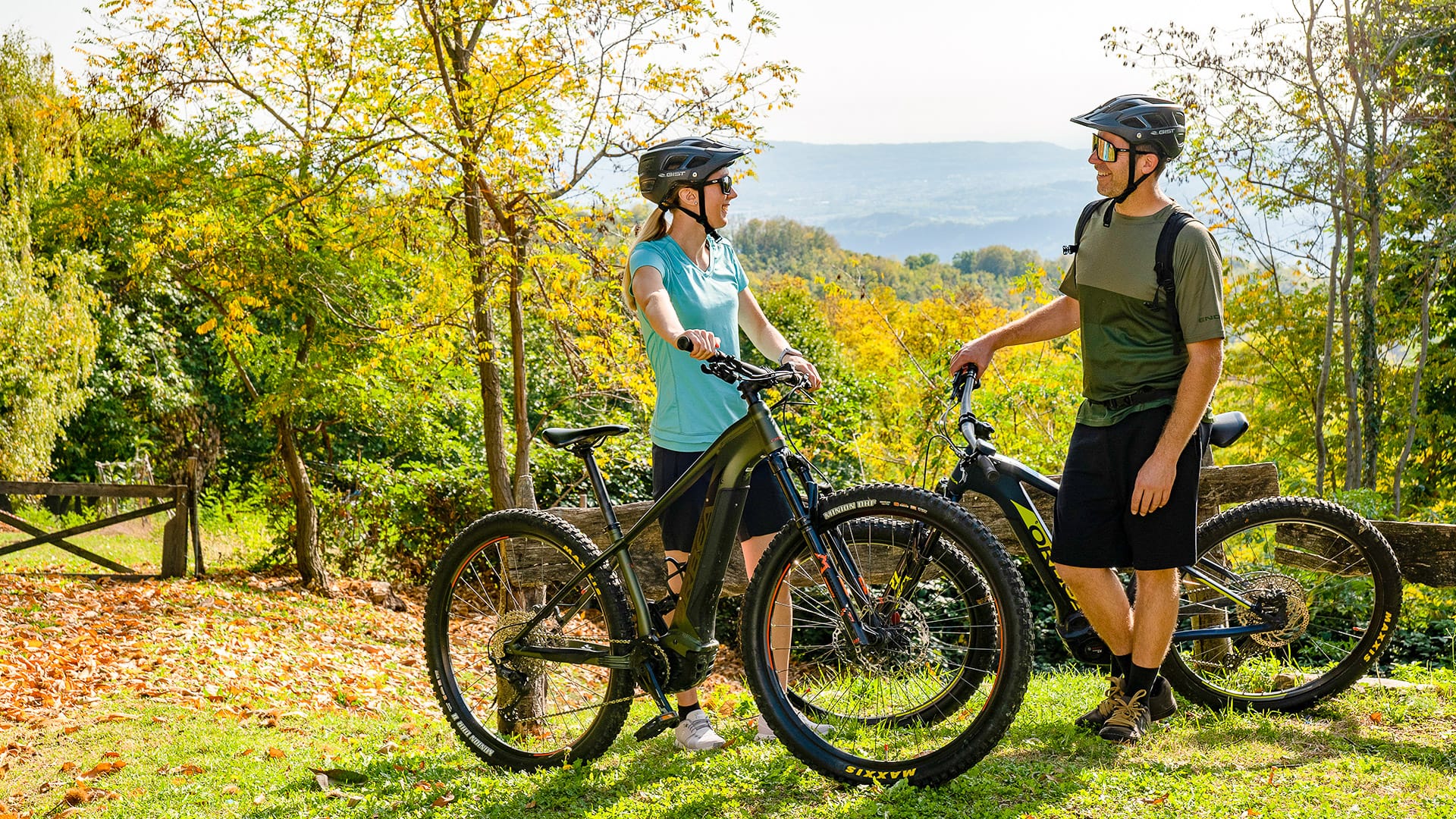 Two cyclists taking a break at a rest stop in the Prosecco Hills, Veneto, Italy