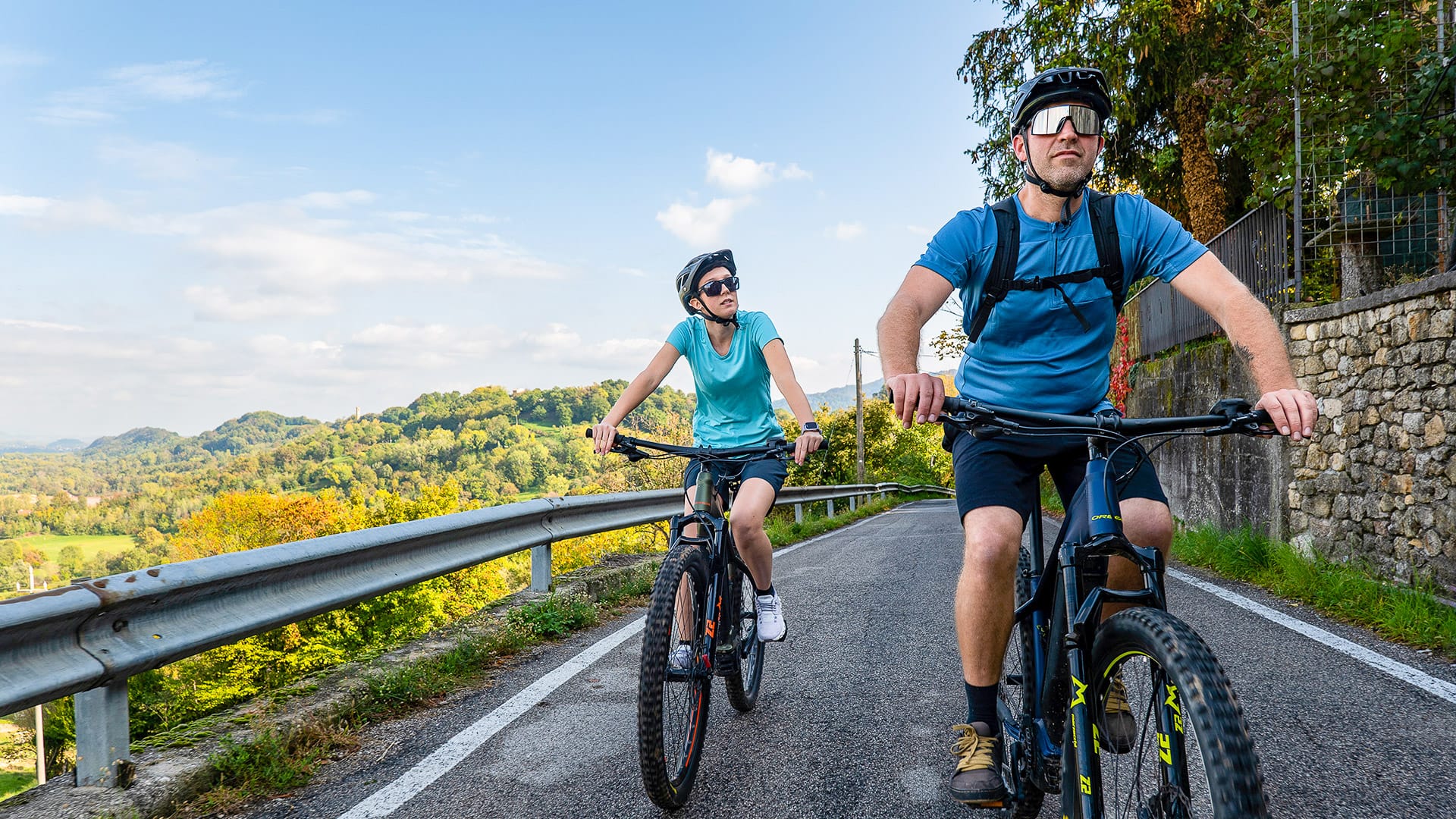 Cyclists riding an e-bike in the Prosecco Hills