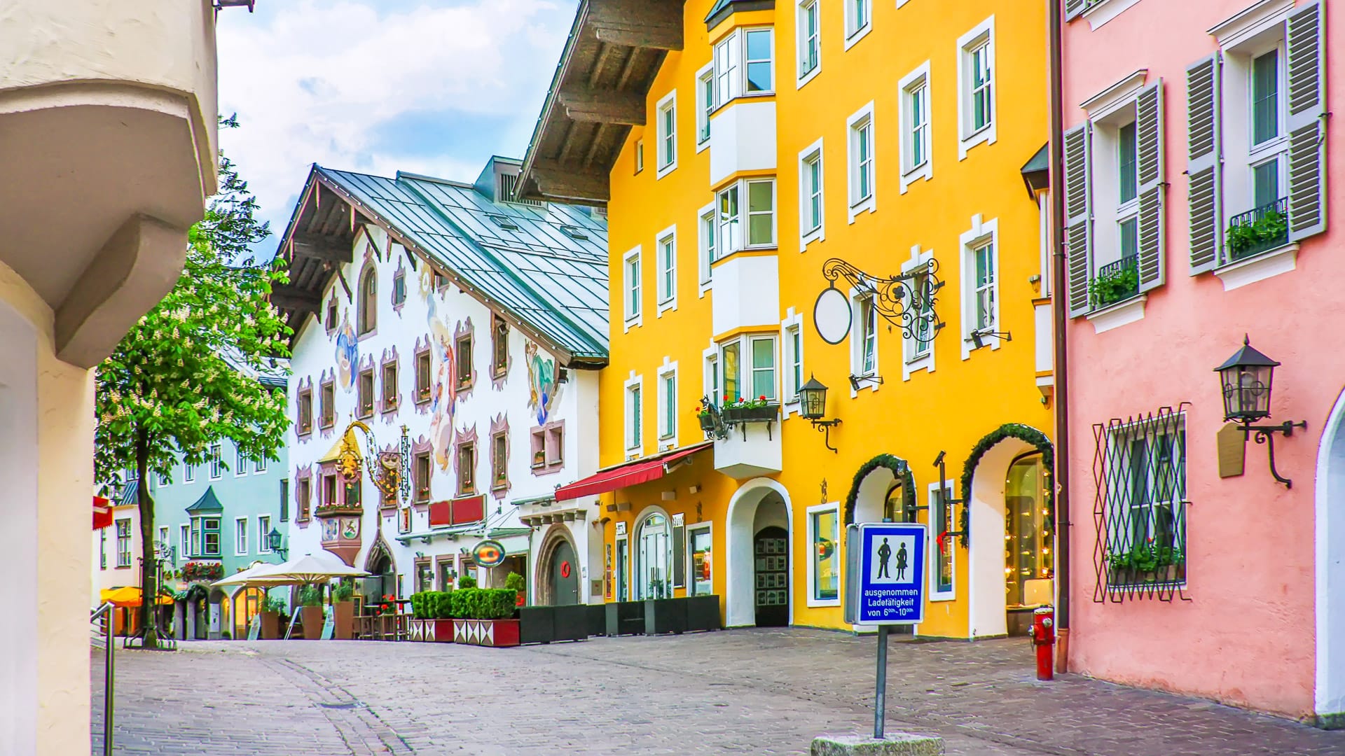 Street with historical houses in Kitzbuhel city center, Austria