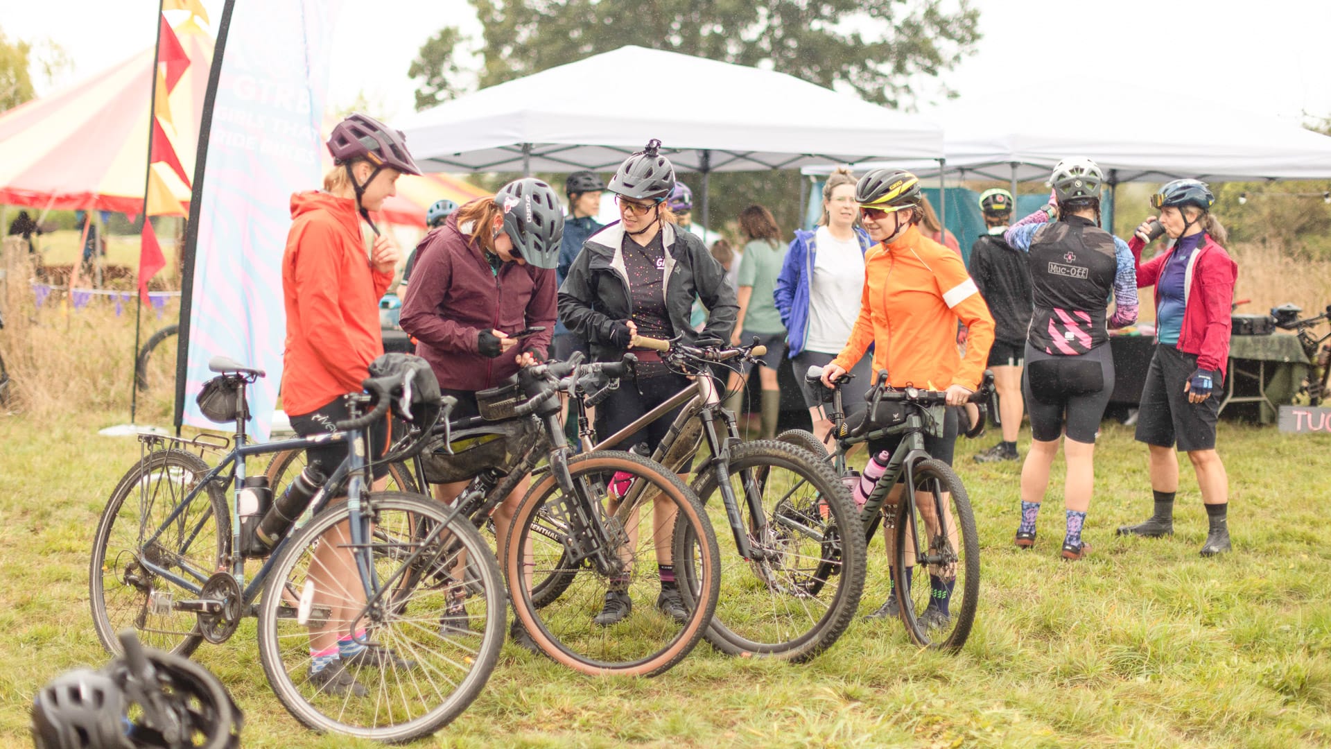 Cyclists getting ready with their bikes before a group ride