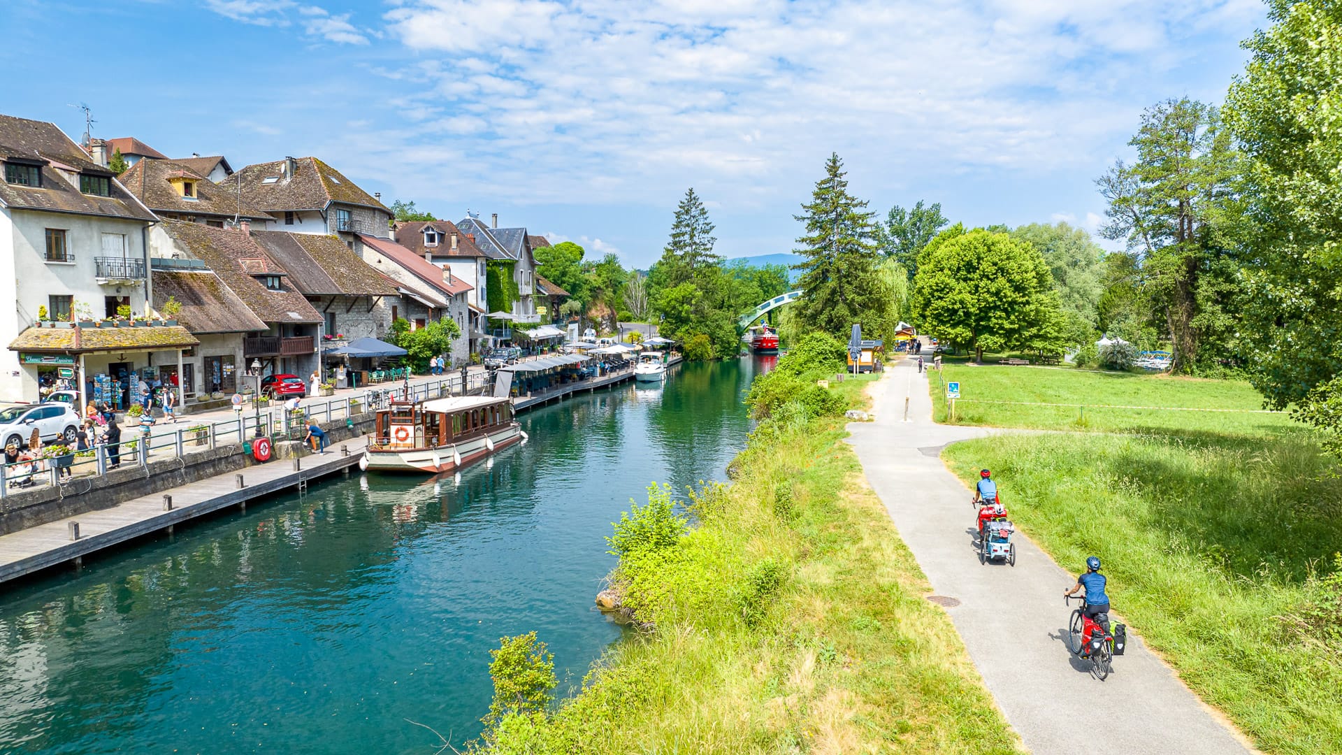 ViaRhôna at Chanaz along the Canal de Savières, with cyclists beside the water in Savoie