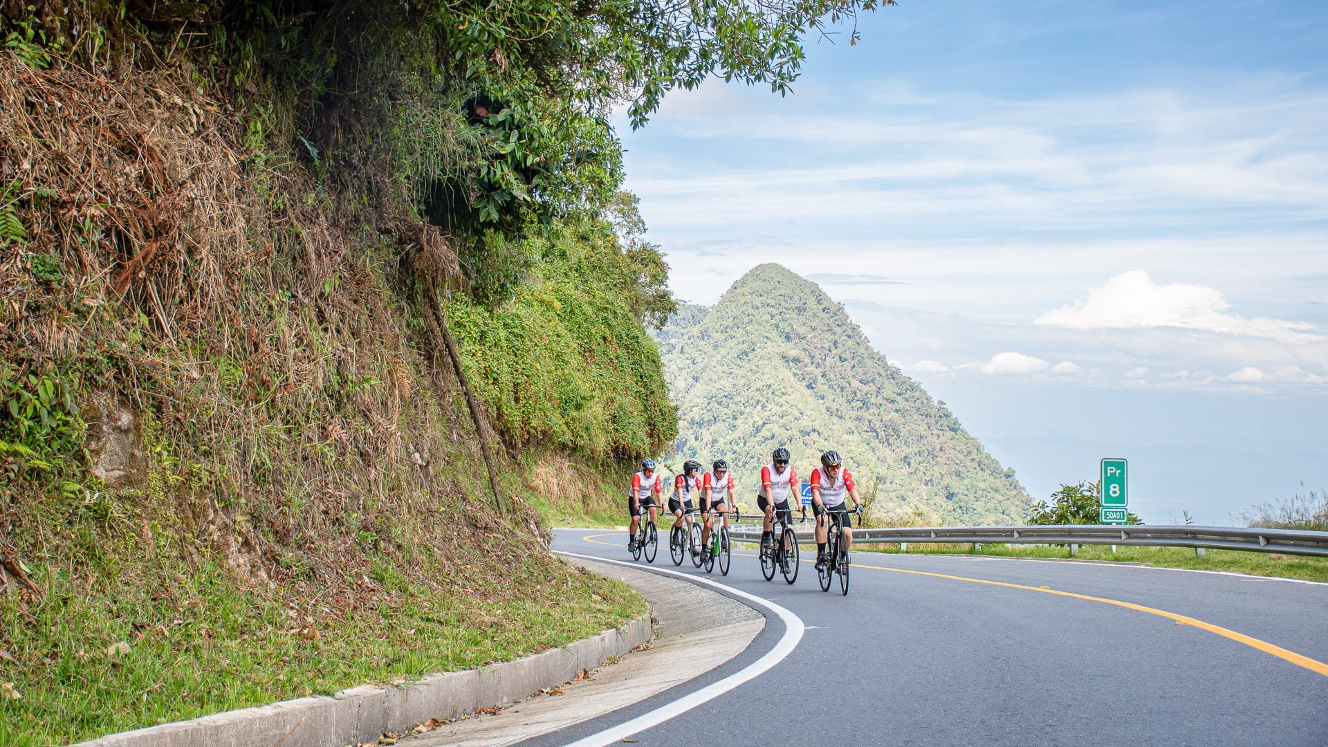 Cyclists climbing the roads of the Alto de Letras region