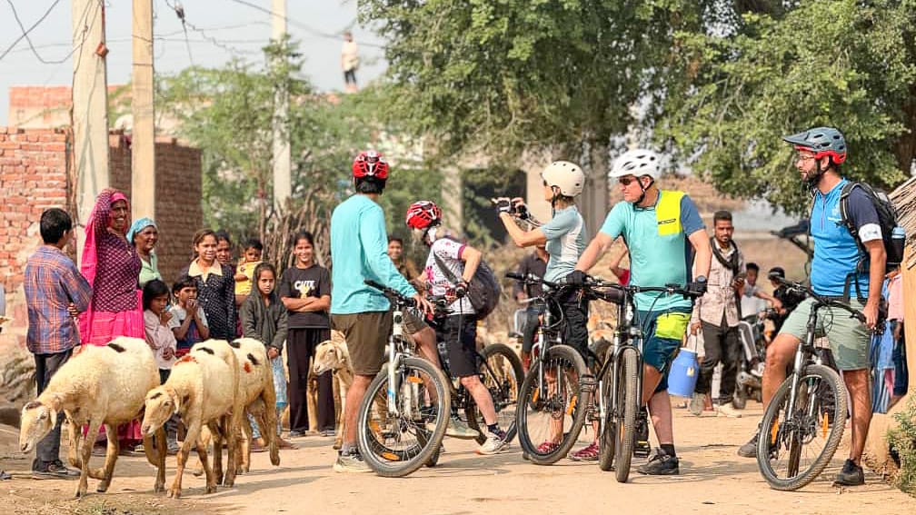 Boat Bike Tours guests interacting with local people in villages near Bharatpur, India