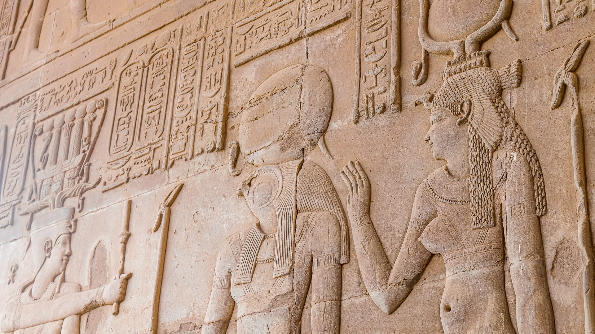 Hieroglyphs carved into a wall at Edfu Temple during a Boat Bike Tours Egypt holiday