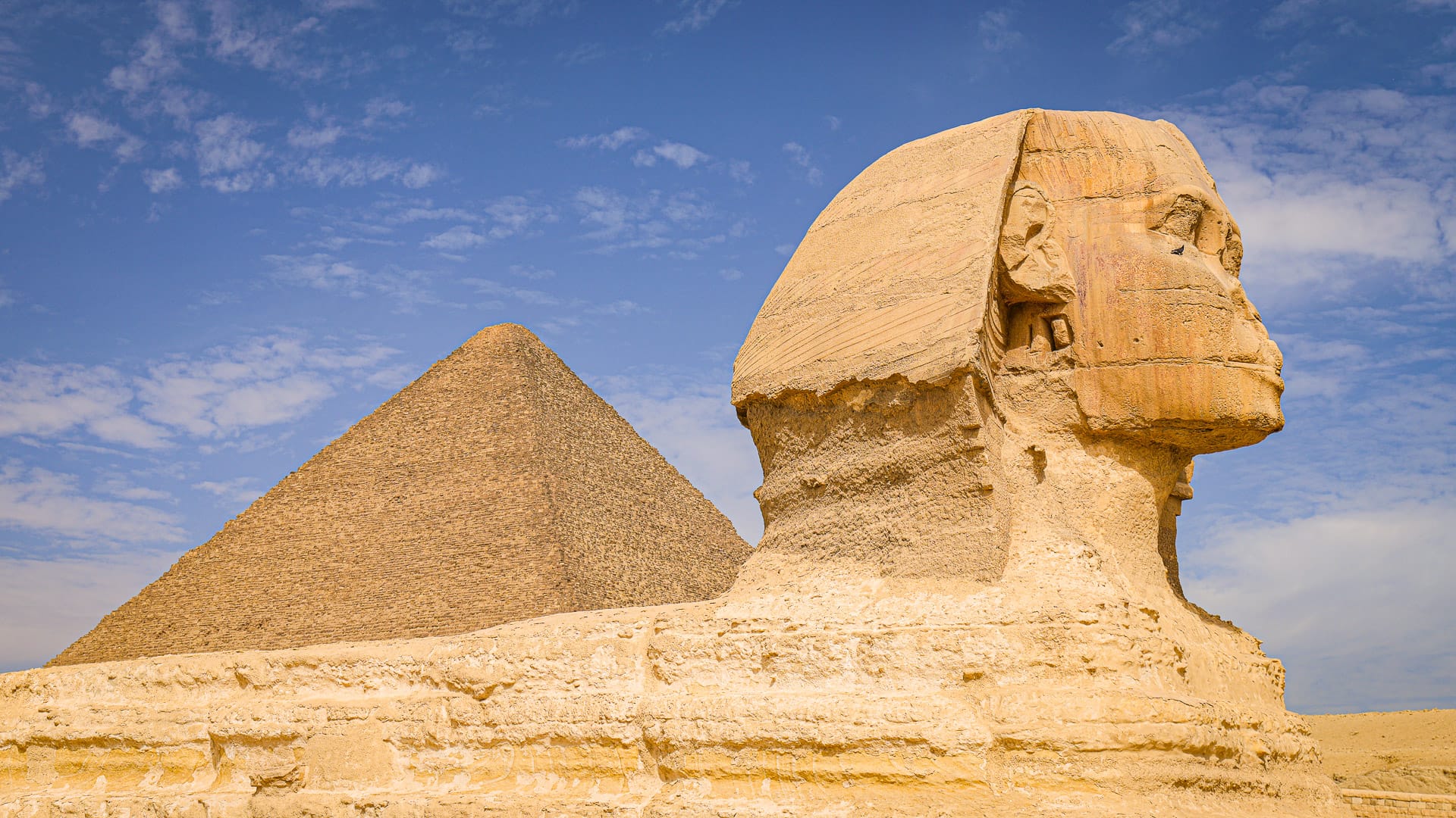 Close-up view of the Great Sphinx and a pyramid during a Boat Bike Tours Egypt holiday