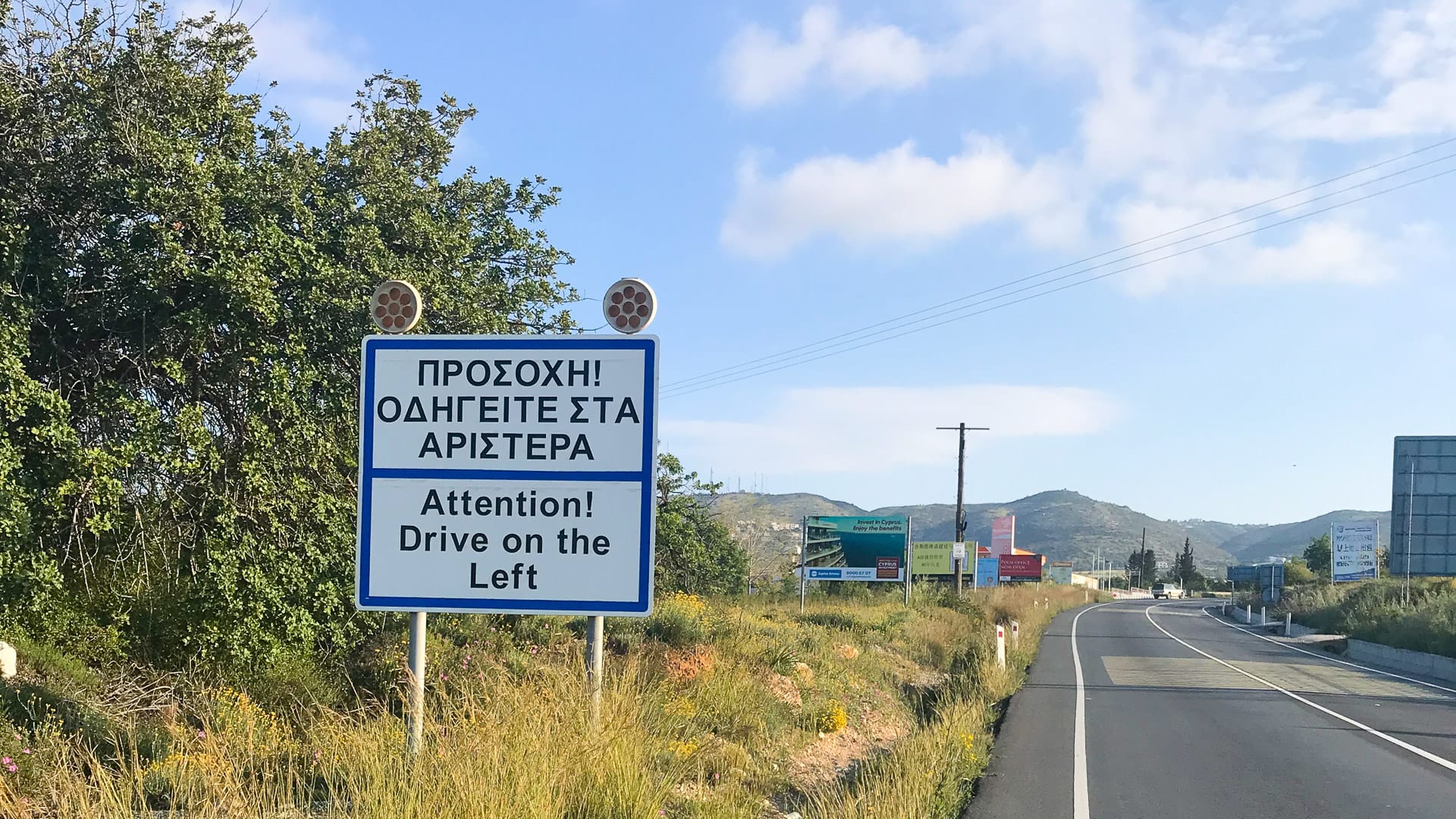 Road sign reminding drivers to drive on the left in Cyprus