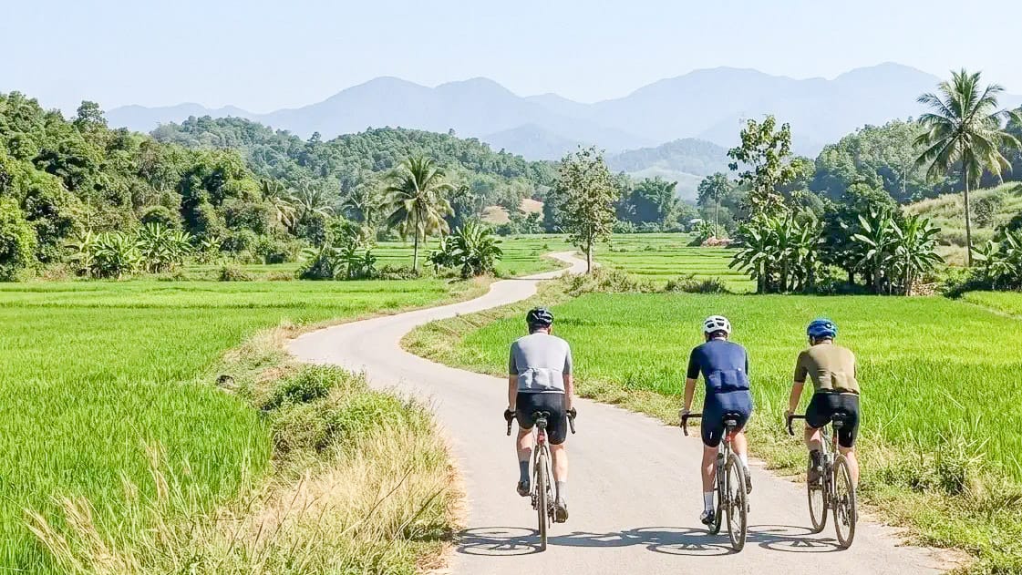 Cycling across the plains near Chiang Rai in Thailand’s Golden Triangle, surrounded by peaceful rural scenery