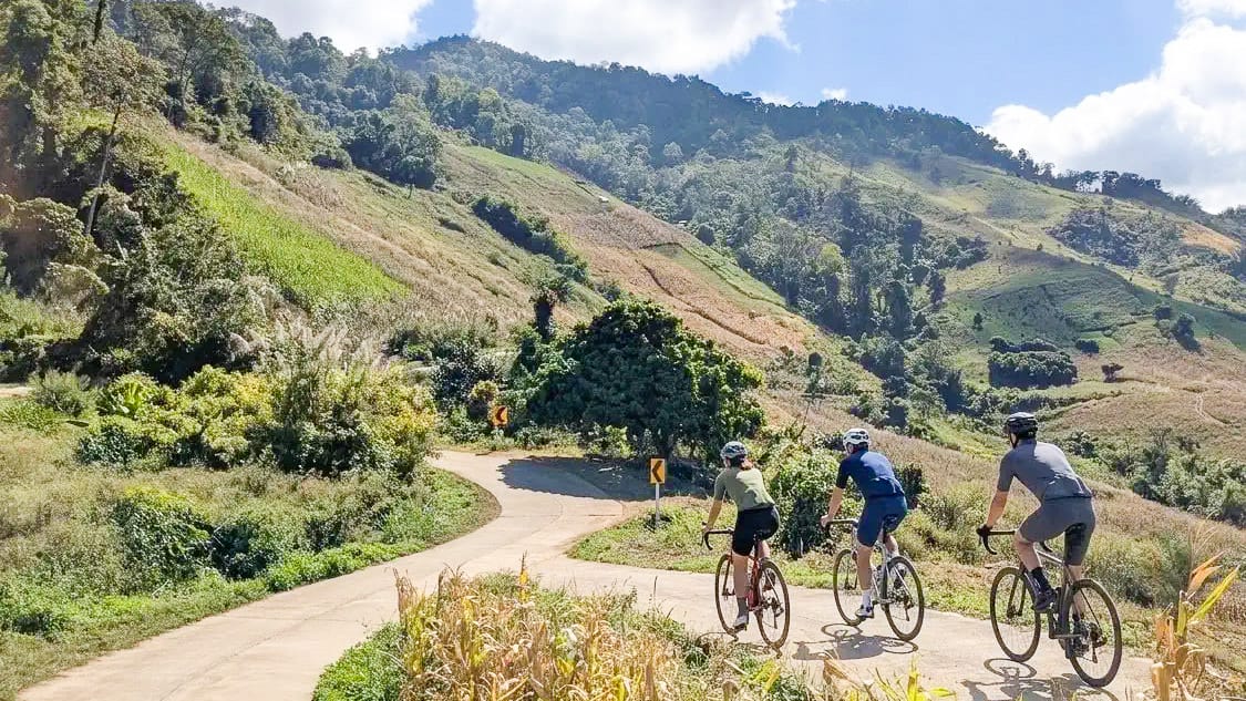 Riders near Phu Chi Fa in Thailand’s Golden Triangle, surrounded by dramatic mountain scenery