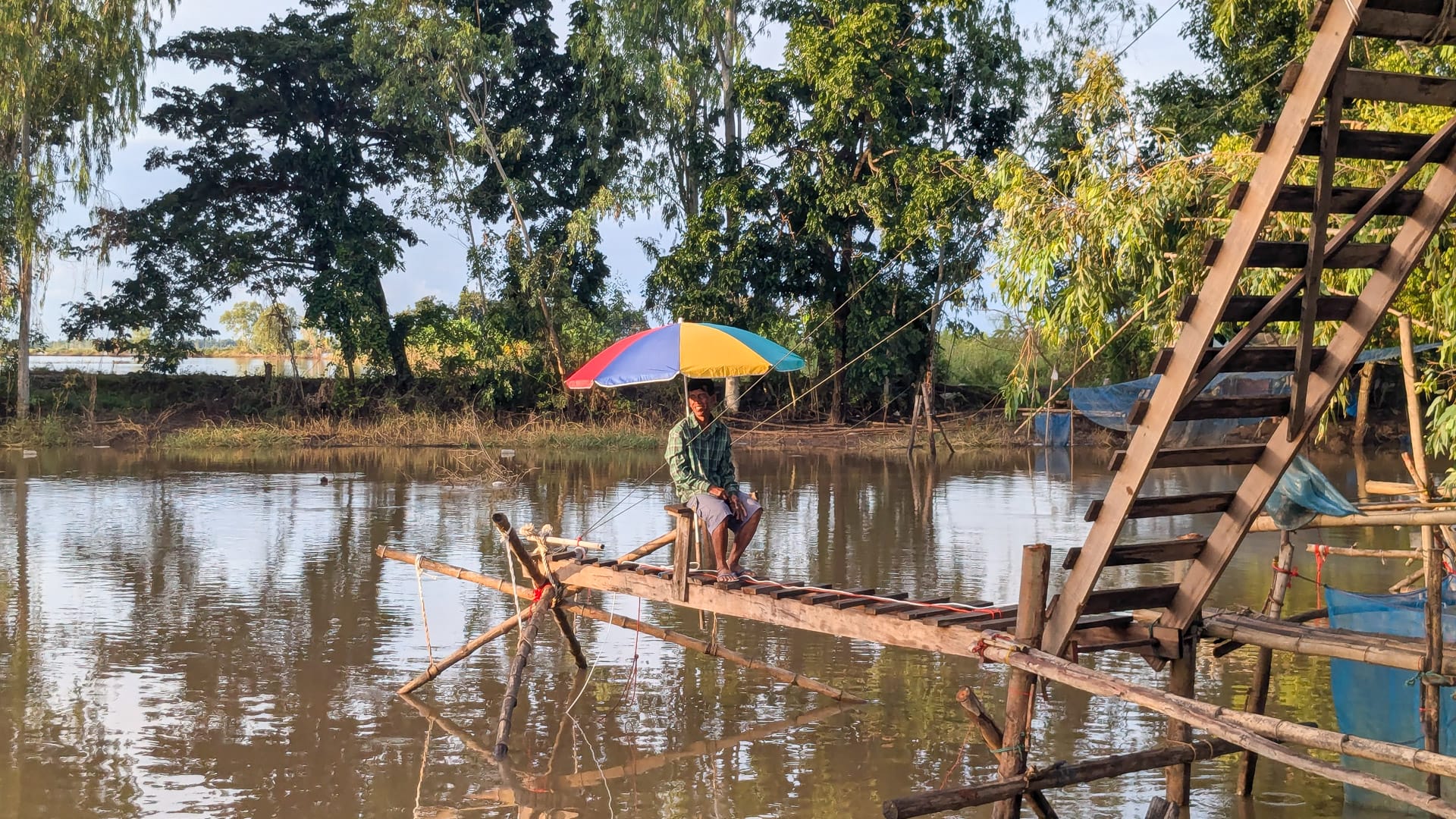 Traditional fishing in Sukhothai, Thailand, seen while cycling through the local countryside
